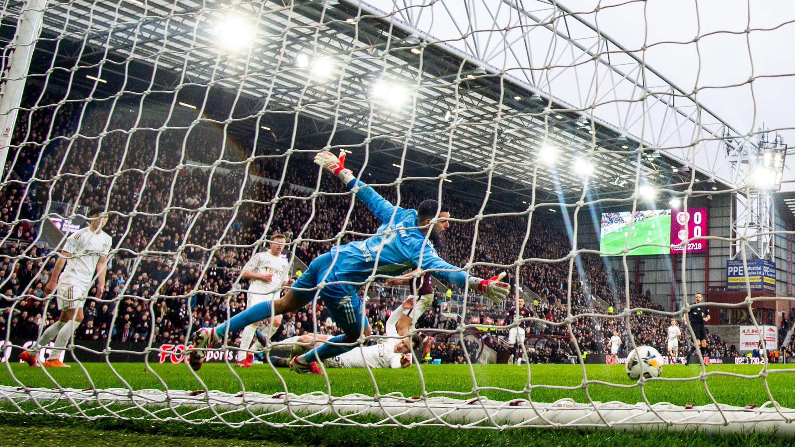 Hearts striker Claudio Braga scores against Aberdeen