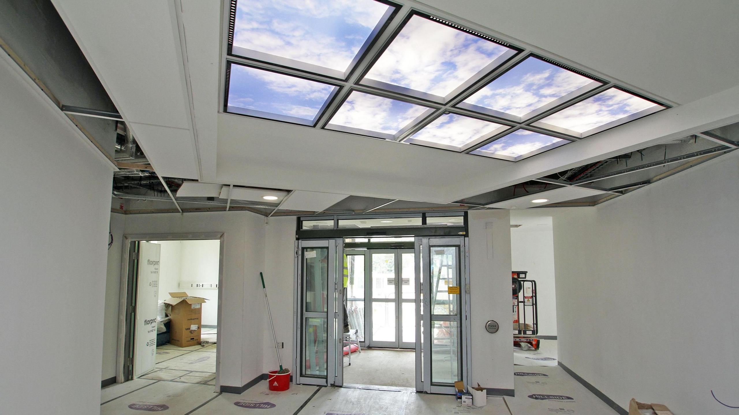 Inside the new health hub with windows on the ceiling and two doors leading outside