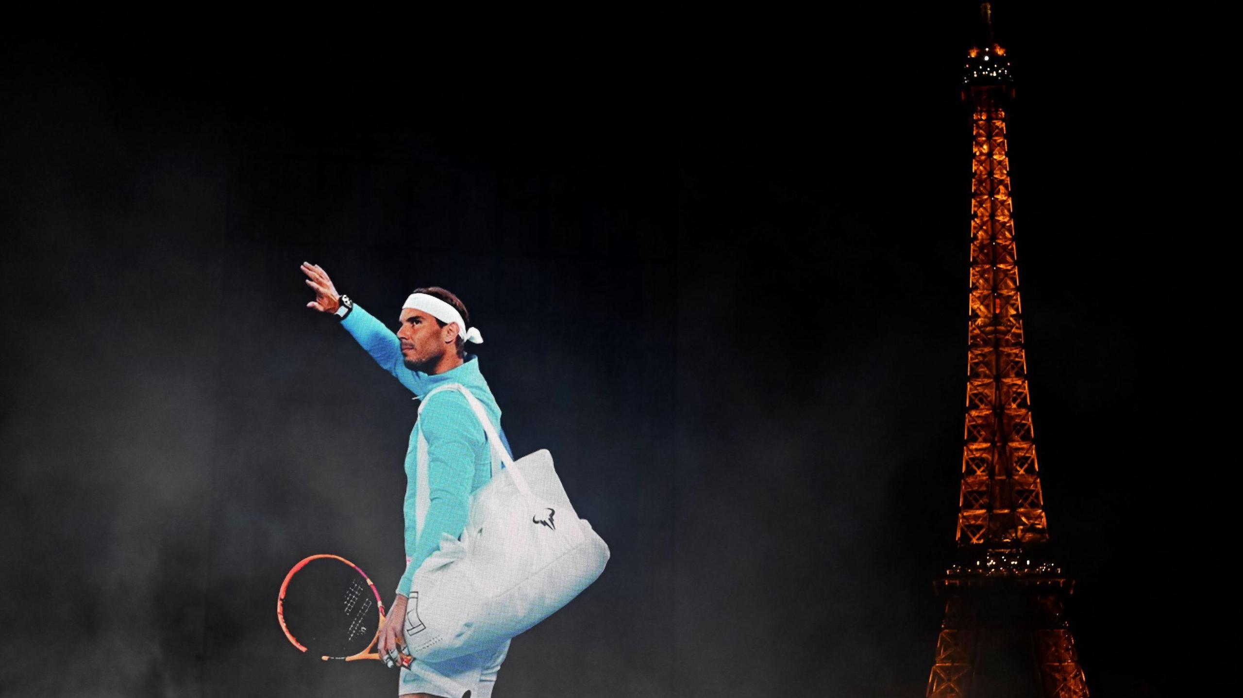 A digital installation projecting images of Rafael Nadal into the Paris sky near the Eiffel Tower