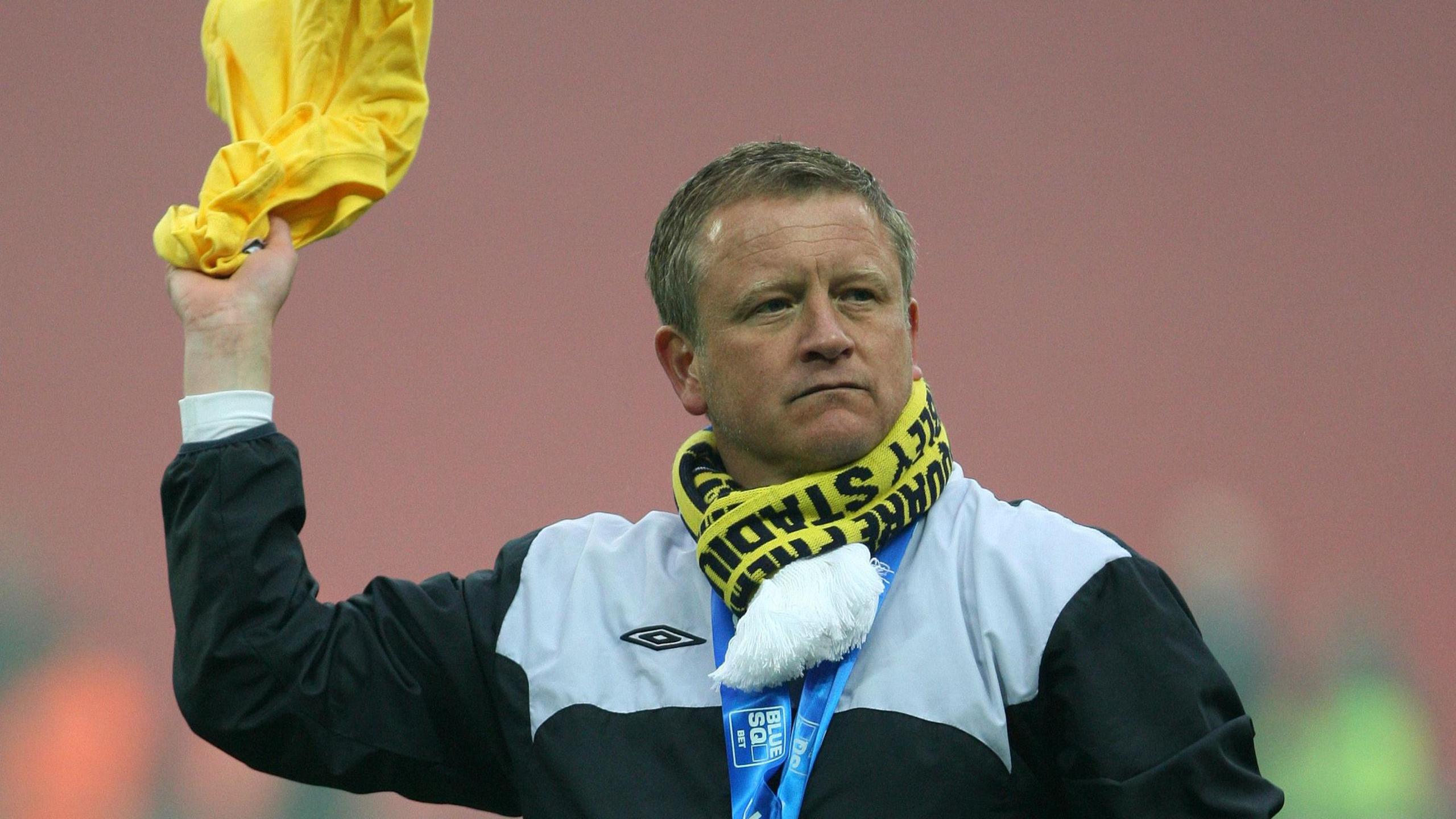 Chris Wilder celebrates leading Oxford to promotion to League Two in 2010