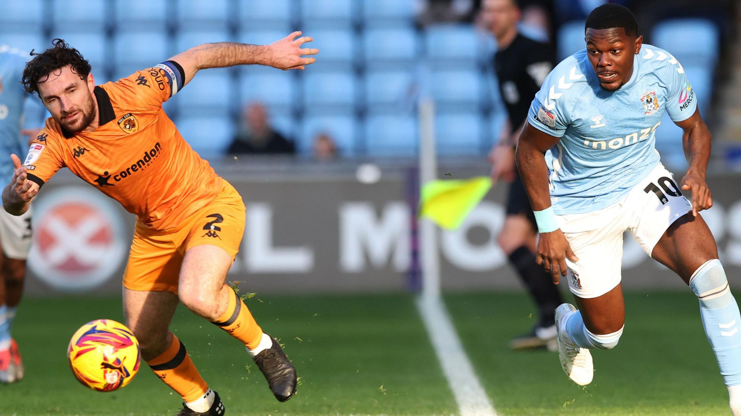 Coventry's Ephron Mason-Clark takes on Hull City's Lewie Coyle