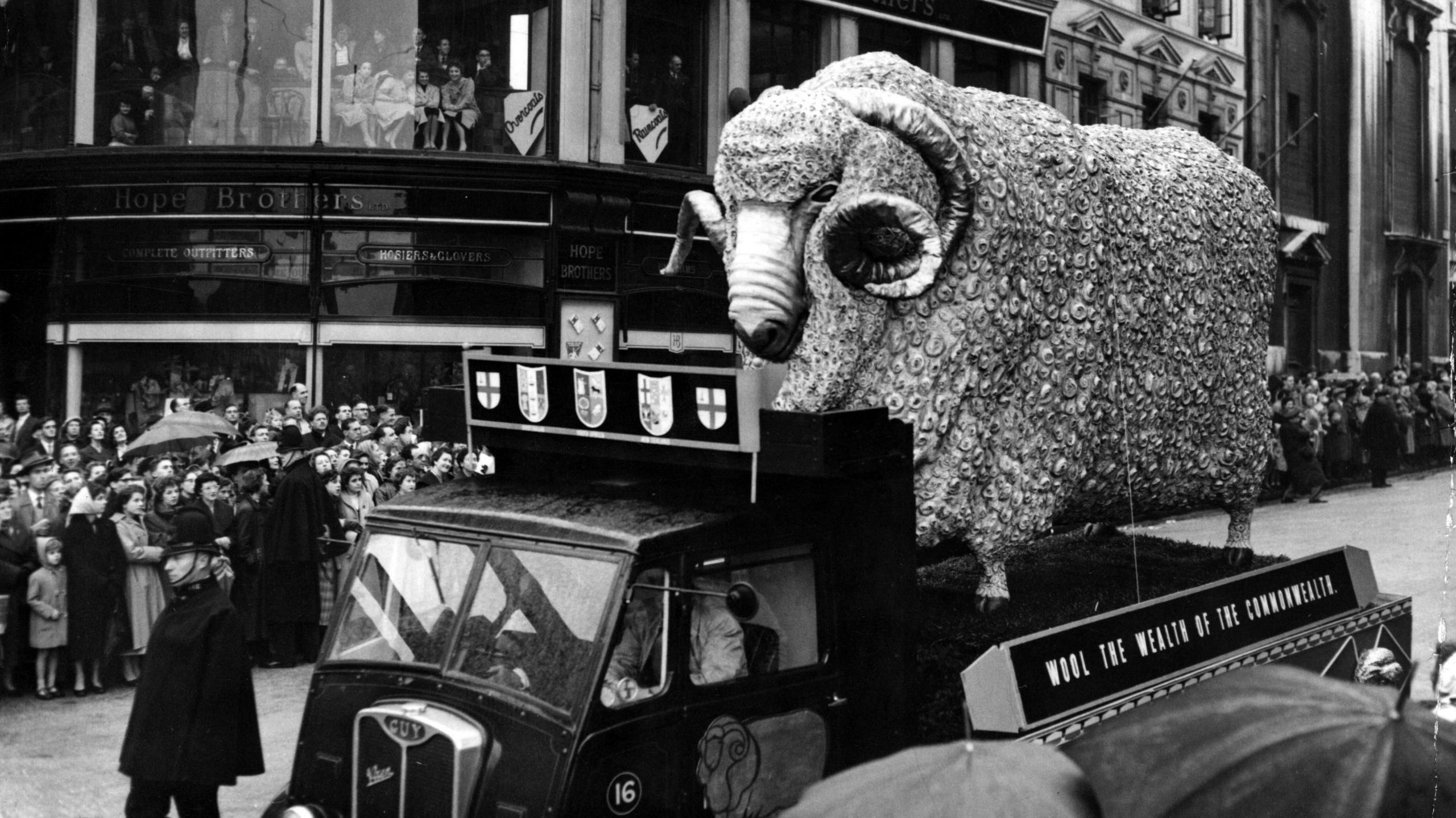 Black and white image of a 15ft tall model of a ram on the back of a lorry during the Lord Mayor's Show in 1955