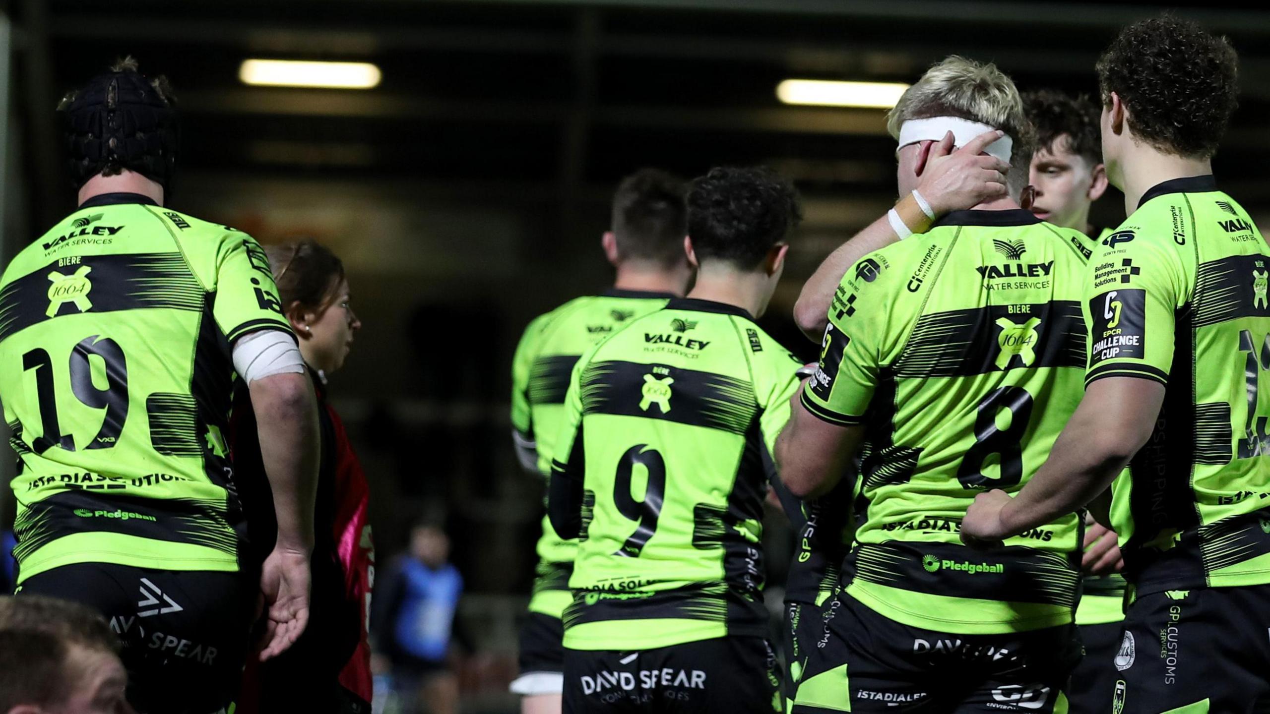 Dragons players celebrate during their victory in Newcastle