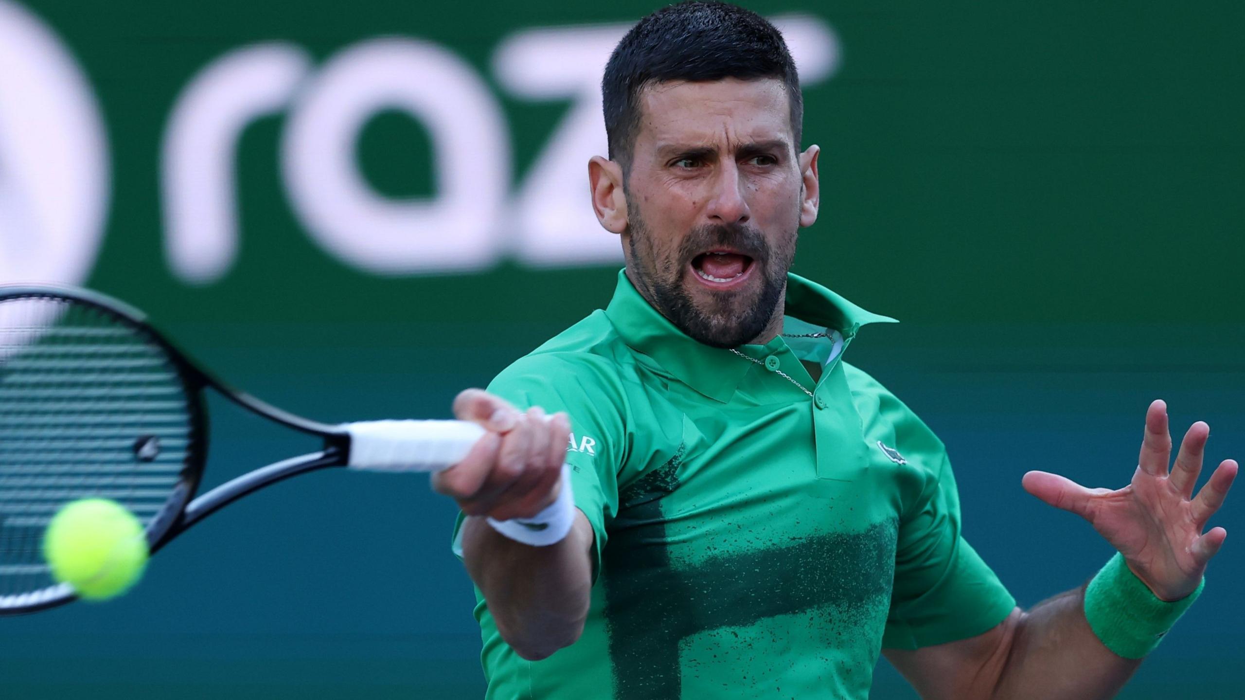 Novak Djokovic hits a forehand during his second-round lucifer  astatine  Indian Wells