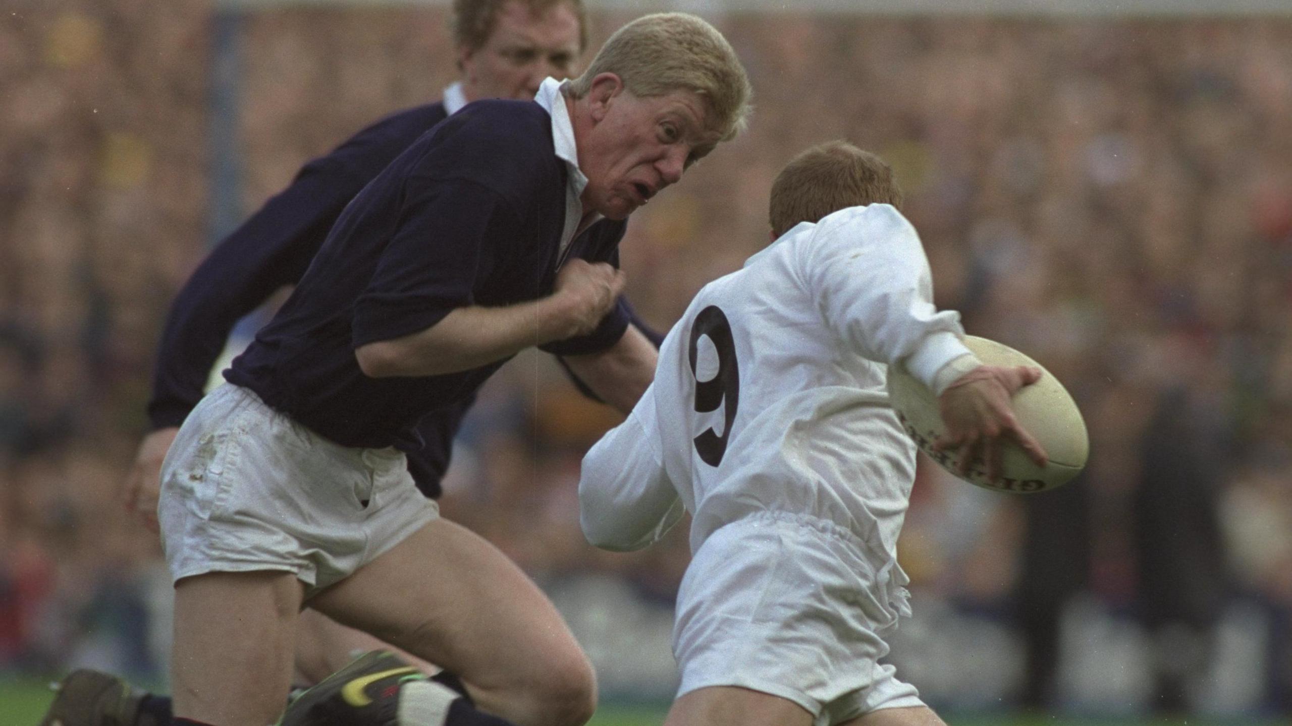 John Jeffrey tackles England scrum-half Richard Hill in the Grand Slam decider of 1990