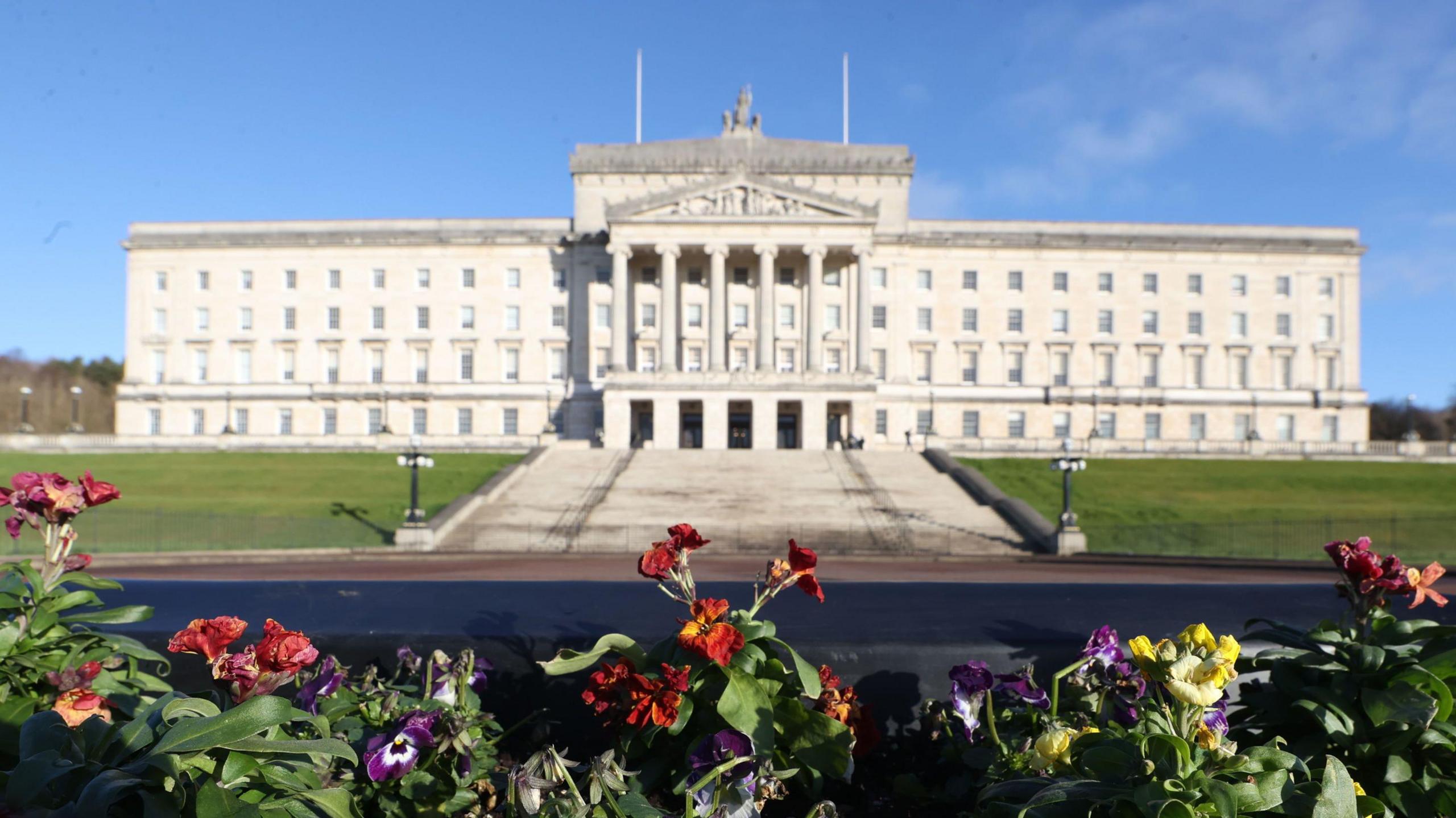 Stormont archive photo showing the building above a flowerbed in the foreground