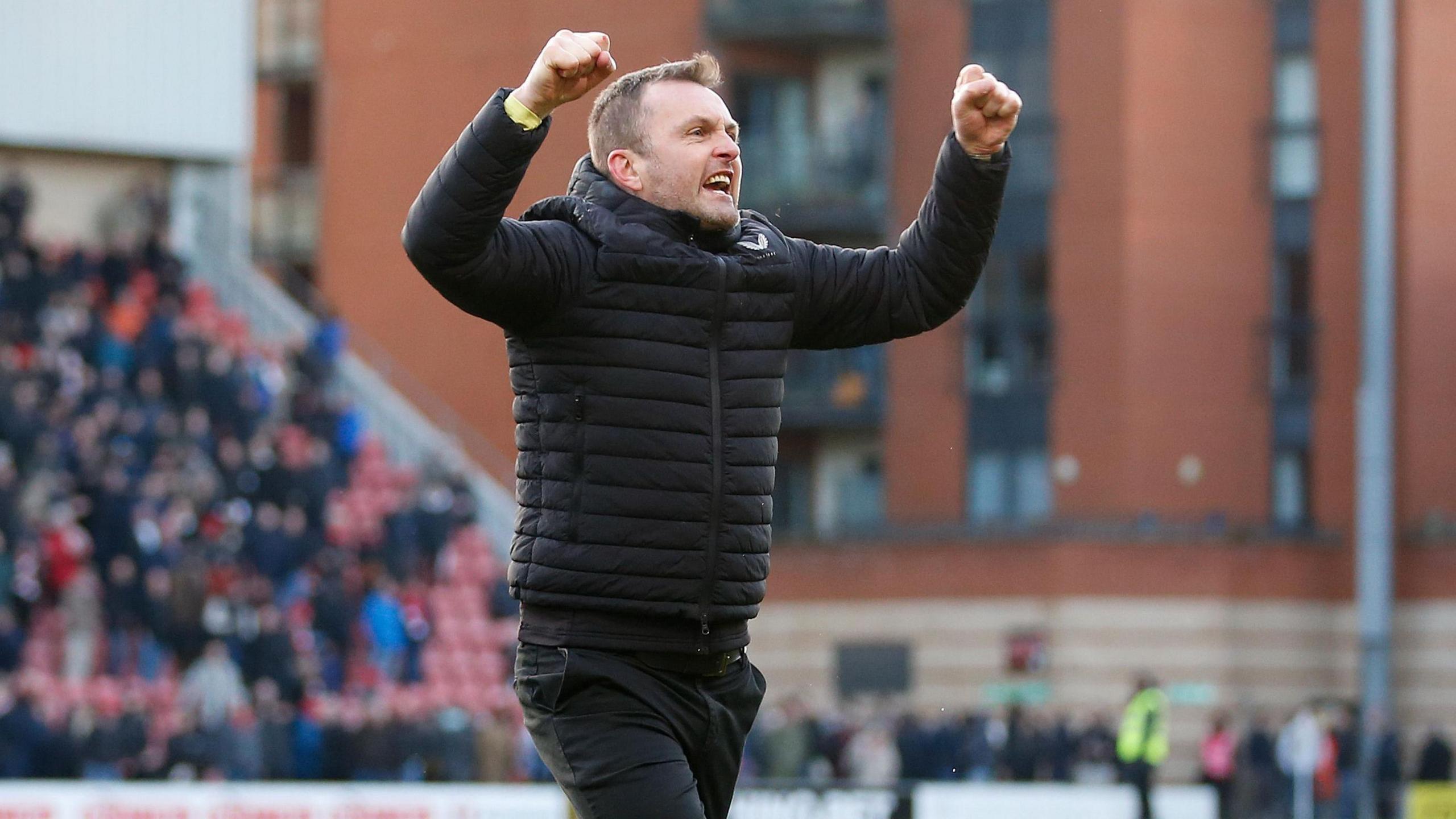 Charlton boss Nathan Jones celebrating their win at Leyton Orient