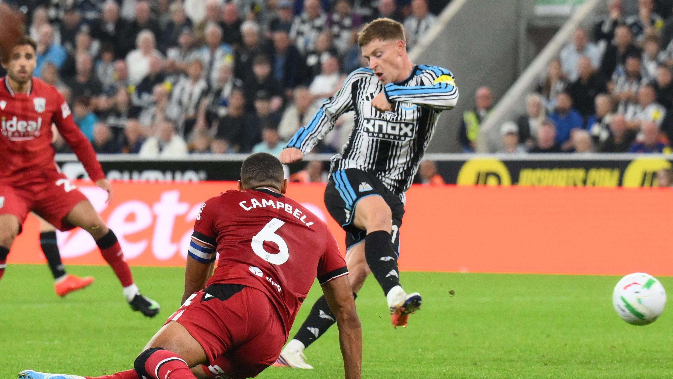 Harvey Barnes leaves West Brom captain George Campbell on his backside as scores the first of his two goals for Newcastle