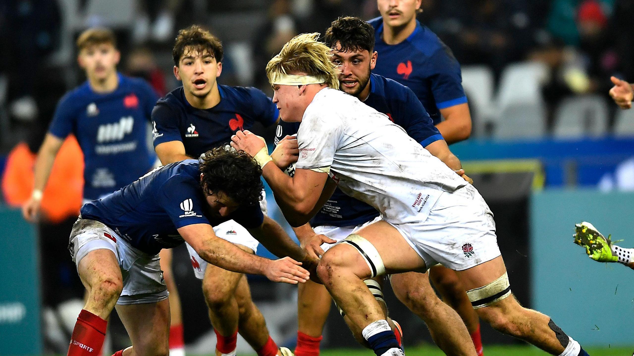 Henry Pollock charges at the France defence during England Under-20s' World Cup final win in South Africa.