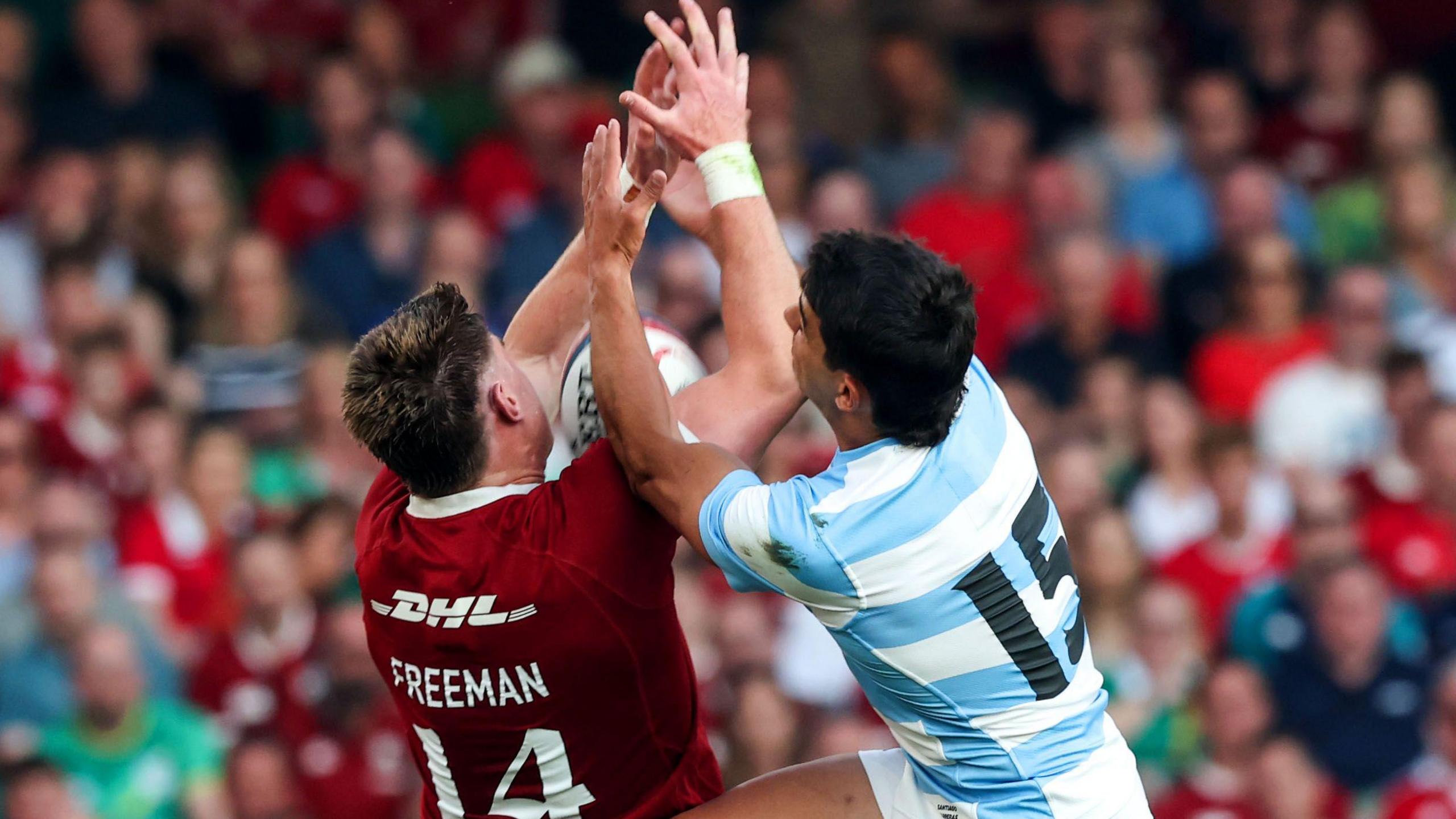Tommy Freeman challenges for a ball in the air