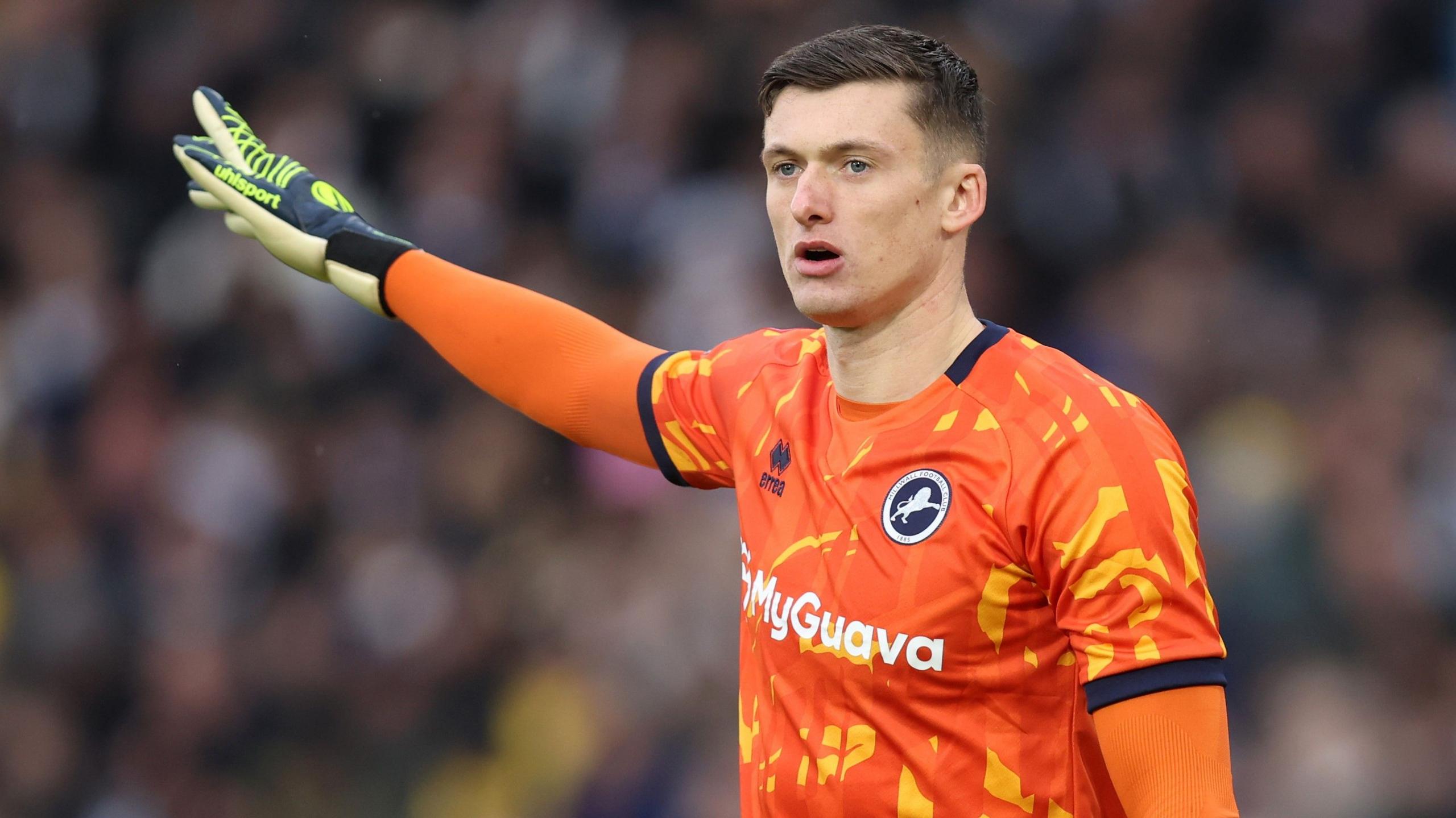 Liam Roberts pictured playing for Millwall, pointing