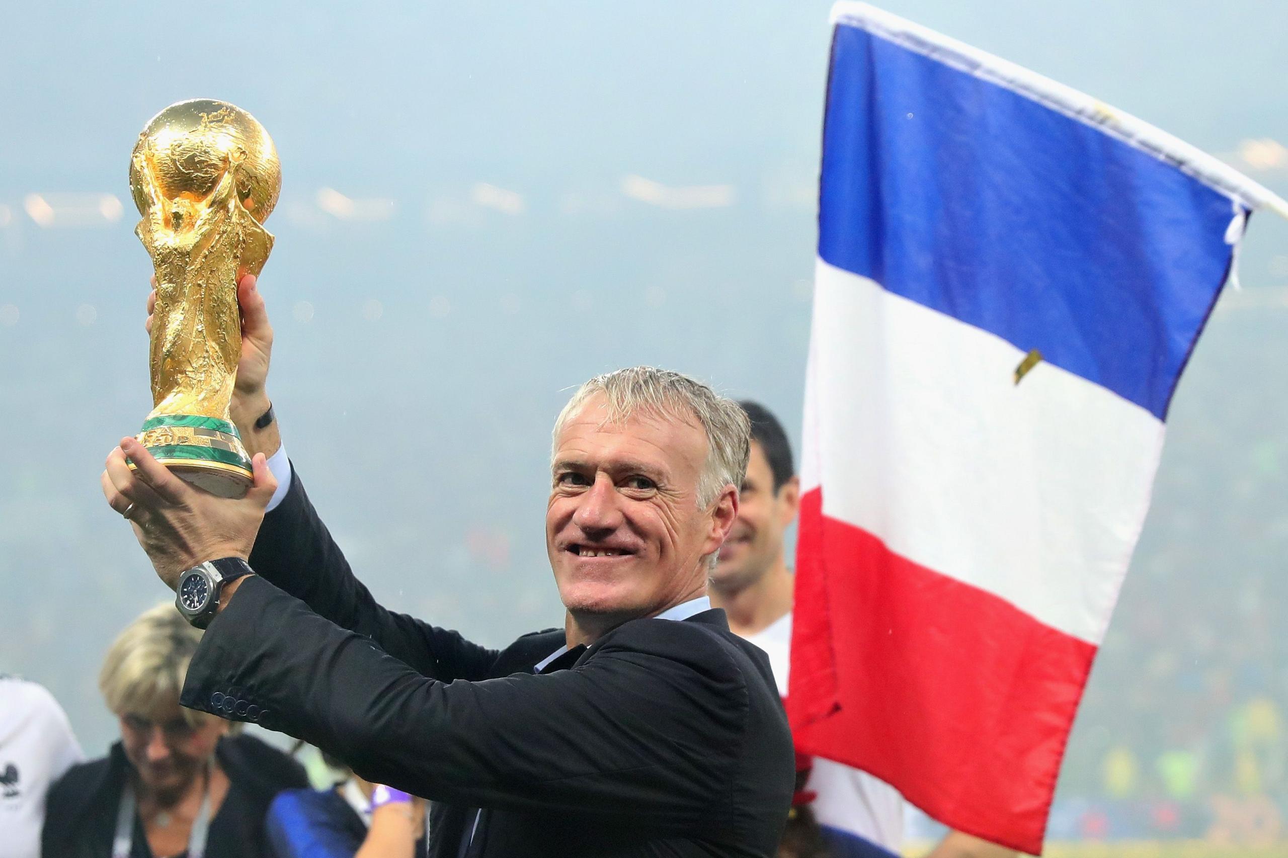 Didier Deschamps celebrates with World Cup trophy in 2018