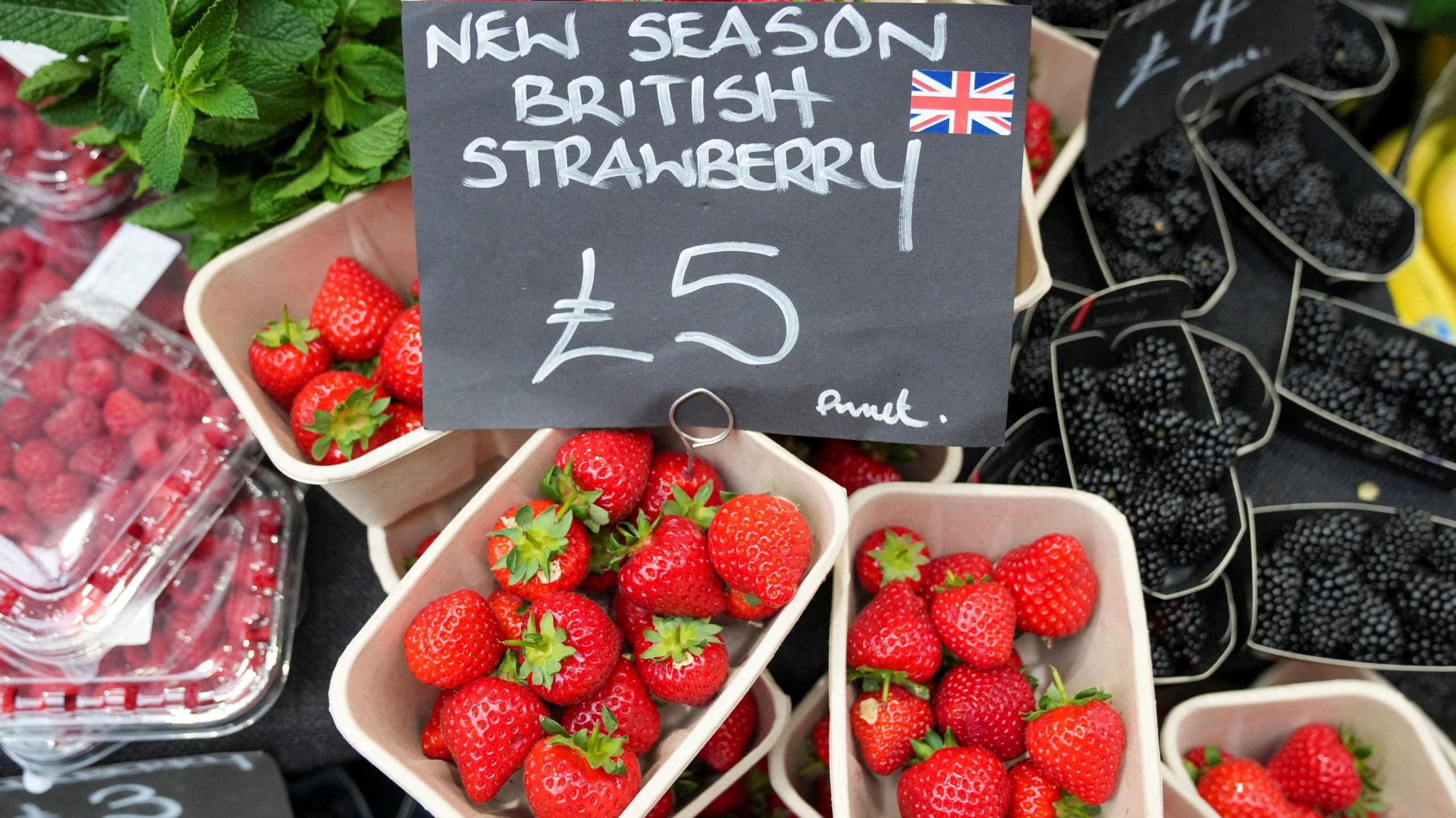 Three punnets of strawberries