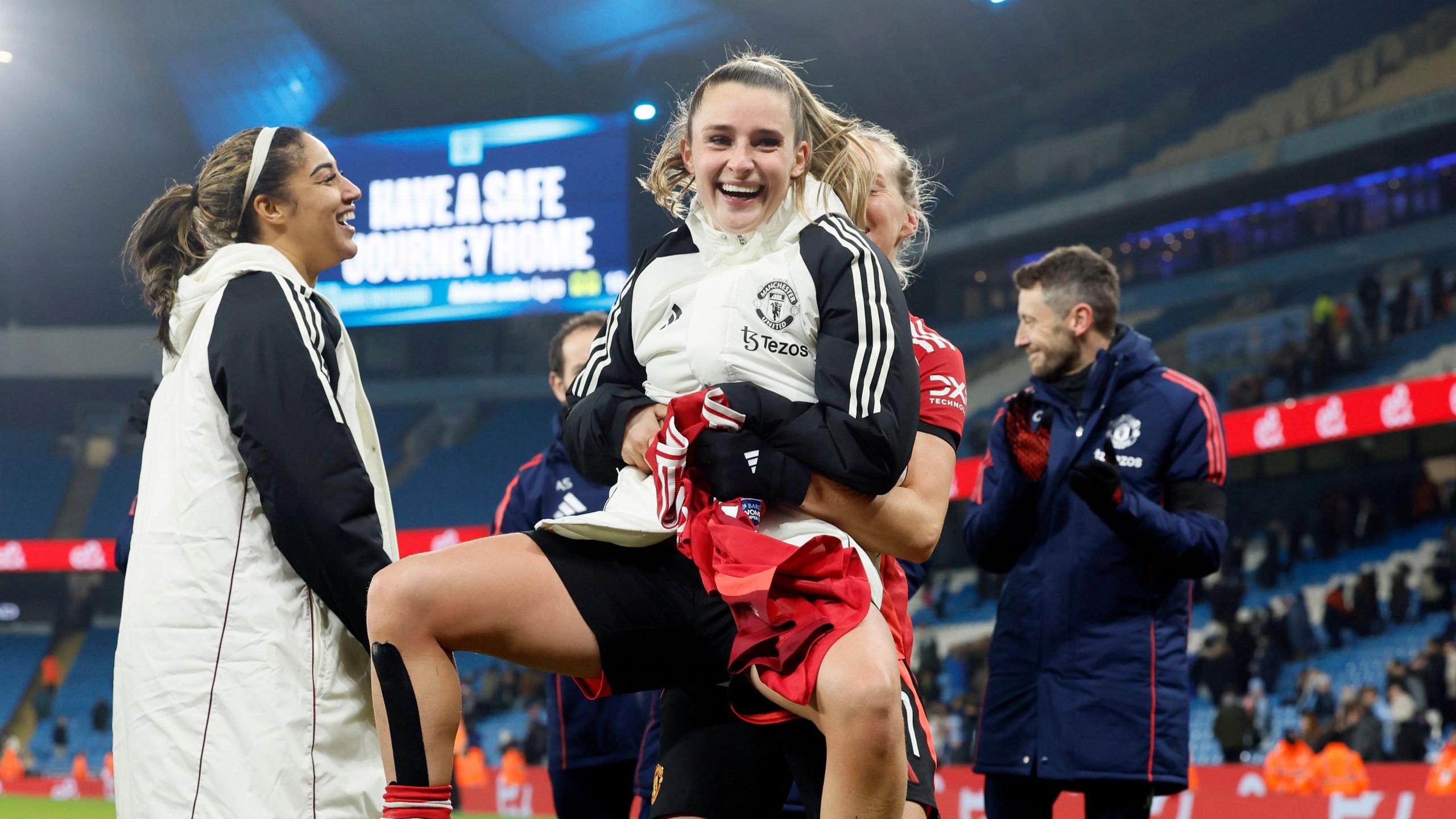 Ella Toone celebrates with team-mates after the match