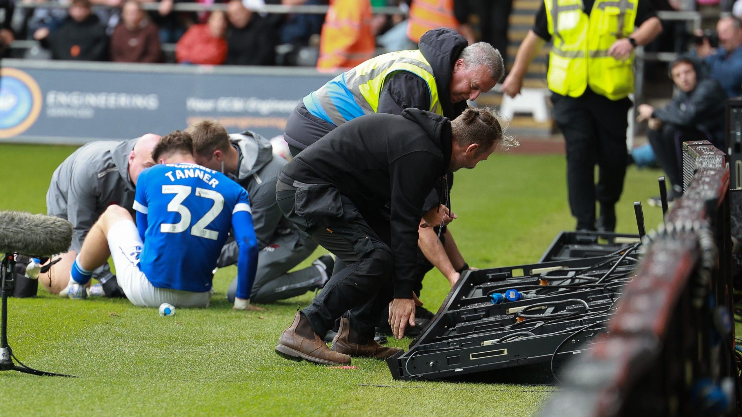 Cardiff City winger Ollie Tanner receives treatment