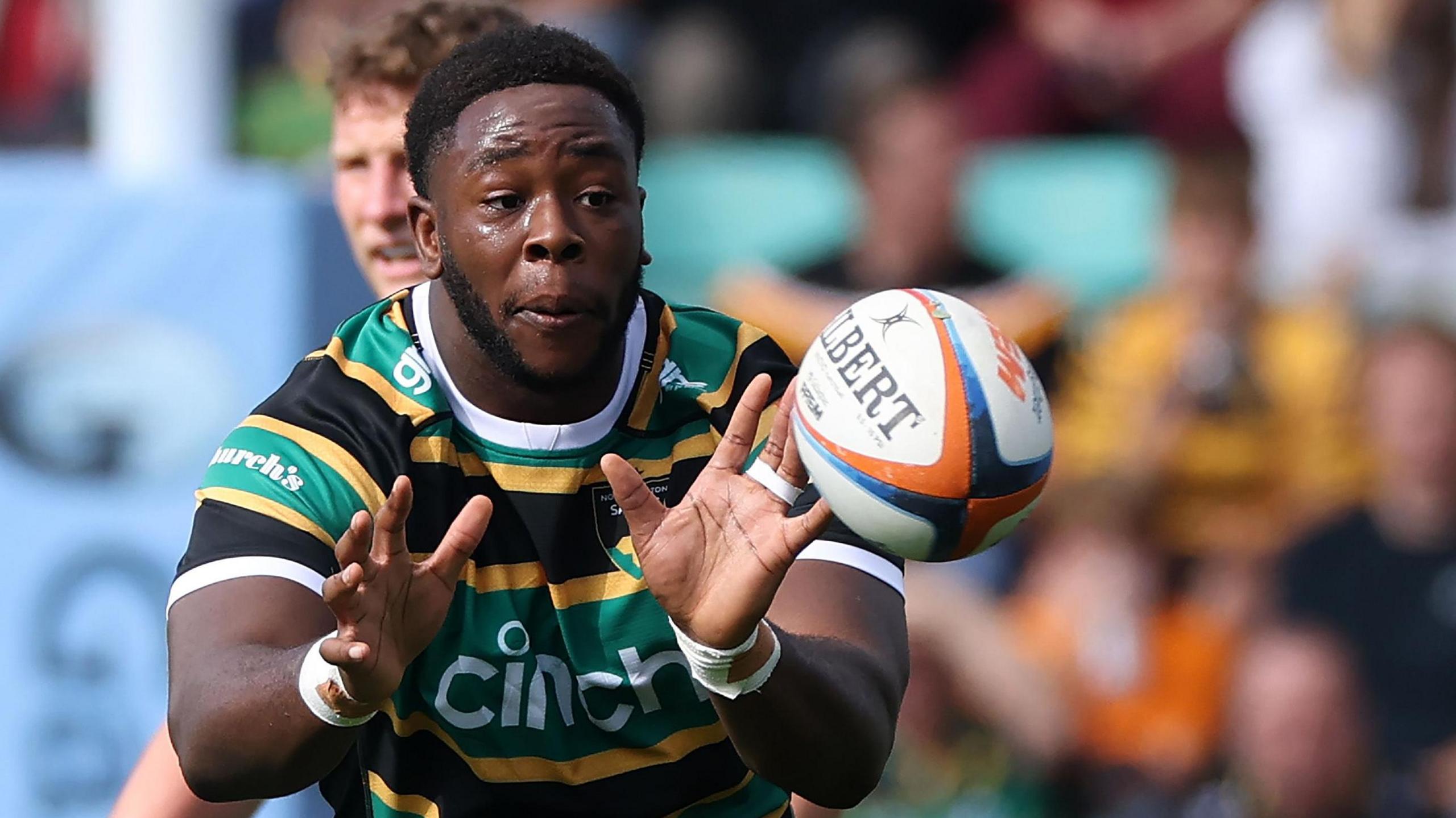 Manny Iyogun prepares to catch a pass for Northampton