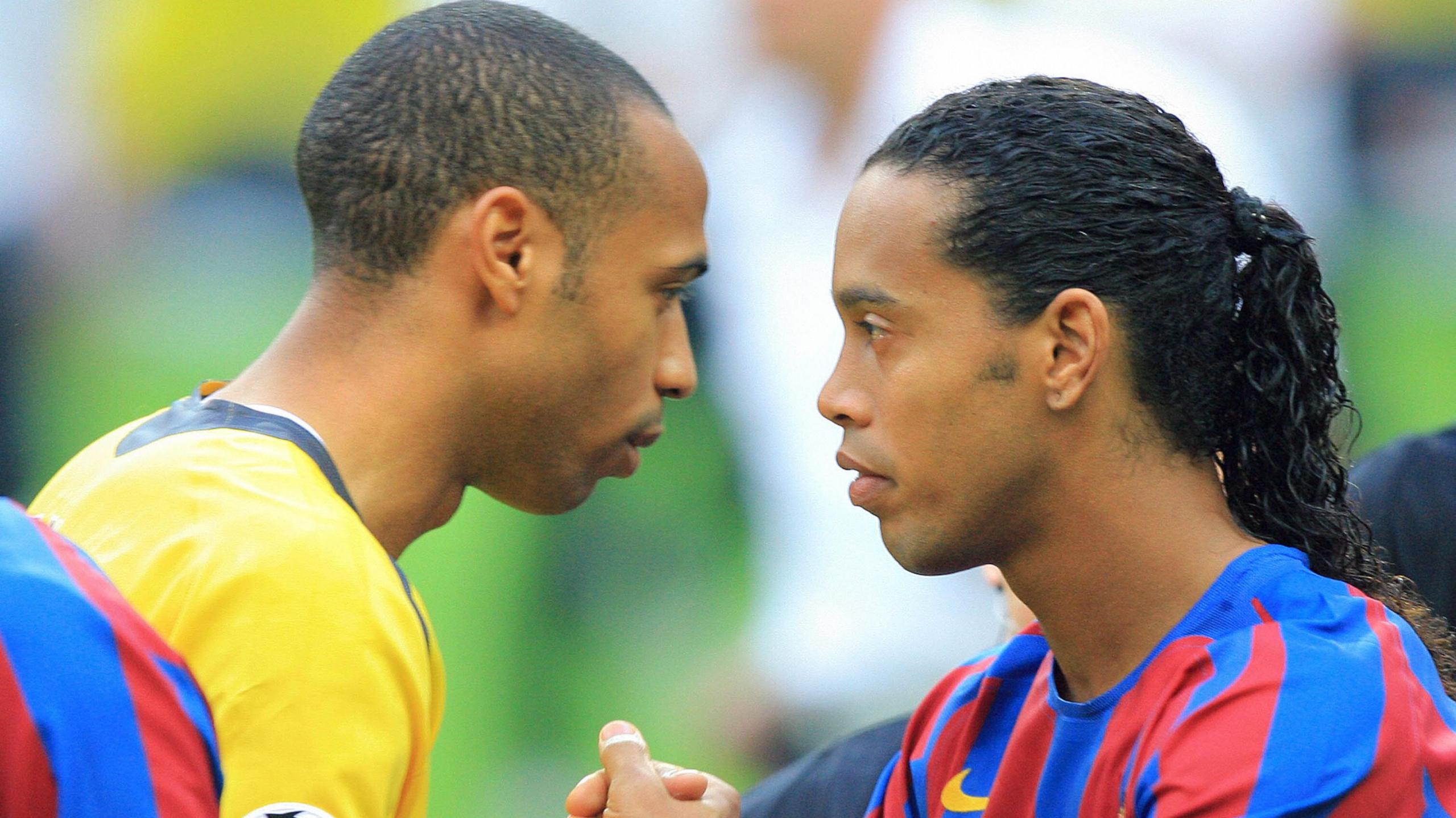 Thierry Henry and Ronaldinho shake hands