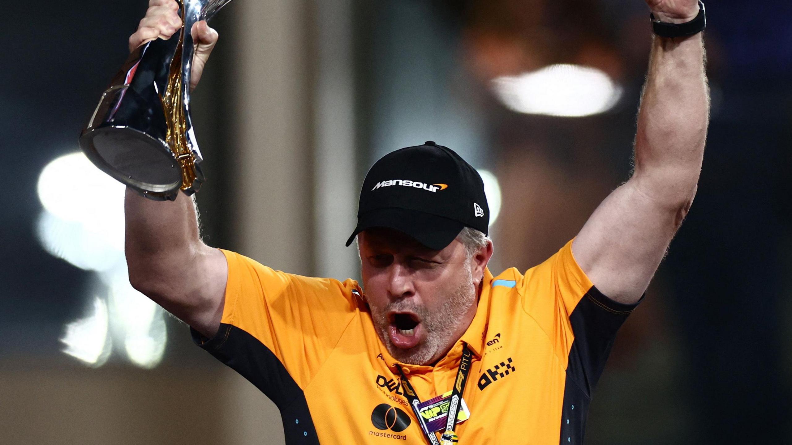 Zak Brown celebrates with the winning constructors' trophy at the Abu Dhabi Grand Prix