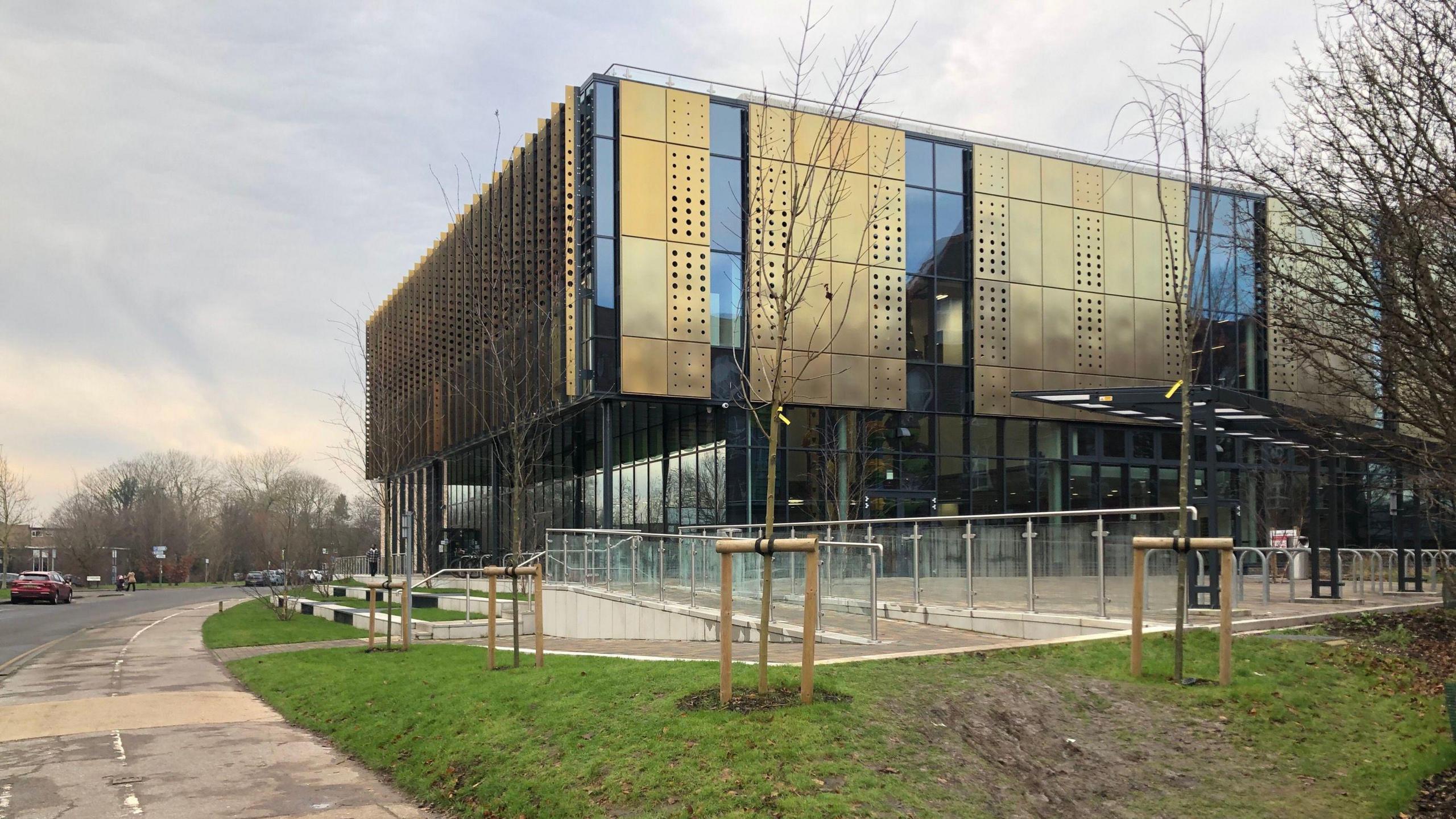 A modern building made of glass and metal. 