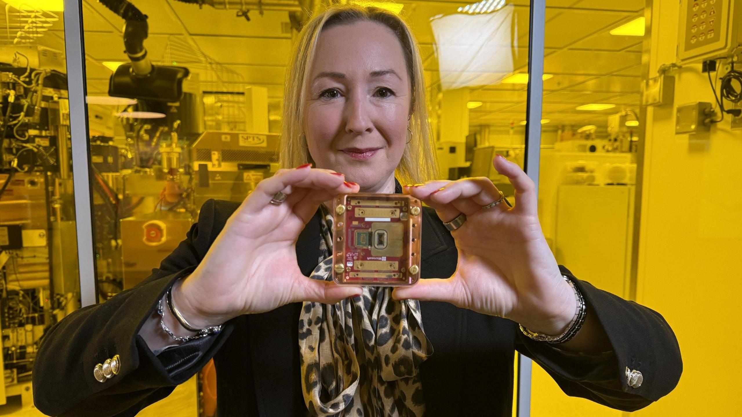 Technology editor Zoe Kleinman holding Microsoft's Mmajorana quantum chip