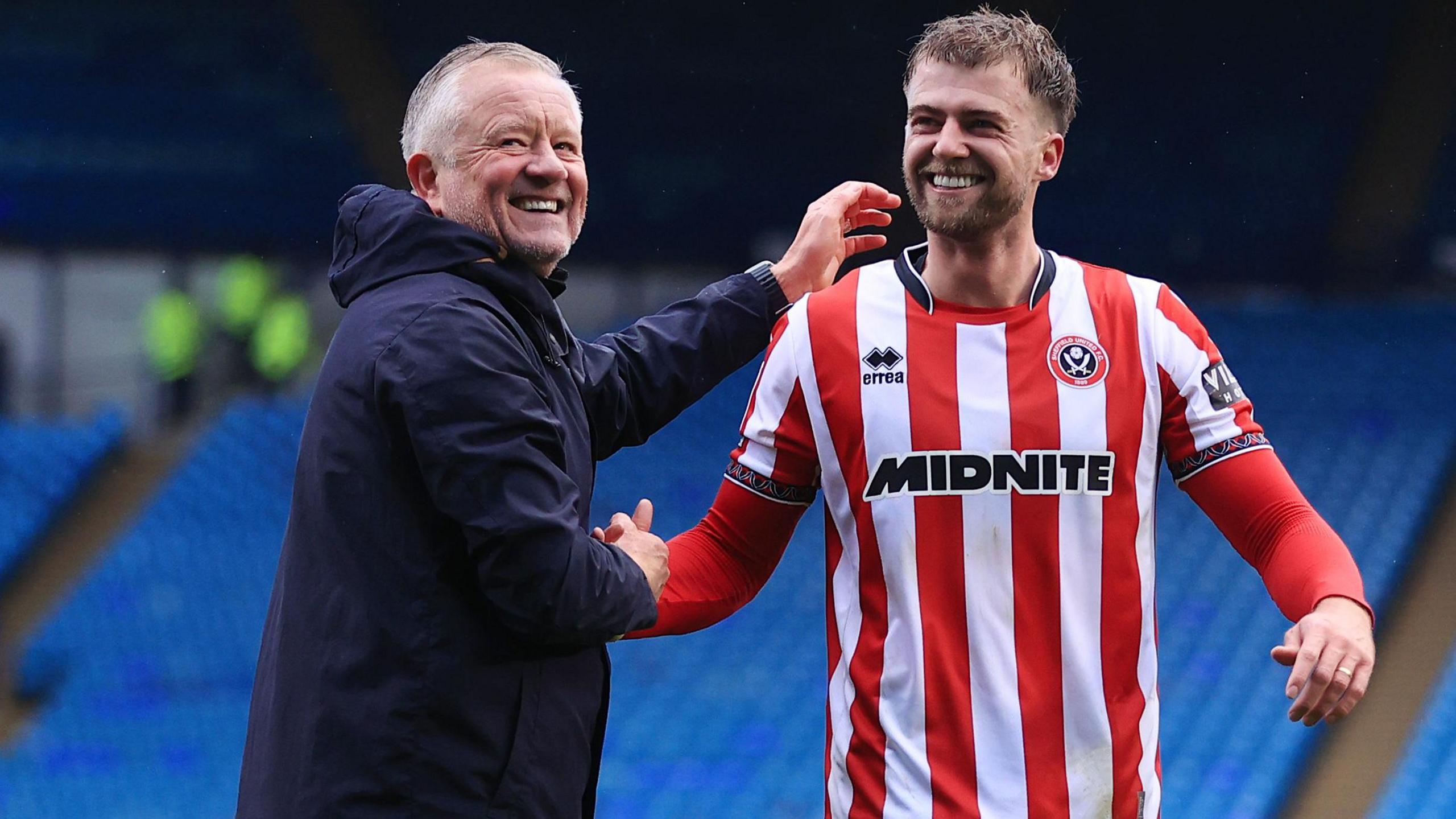 Sheffield United boss Chris Wilder (left) celebrates after the game with new signing Patrick Bamford