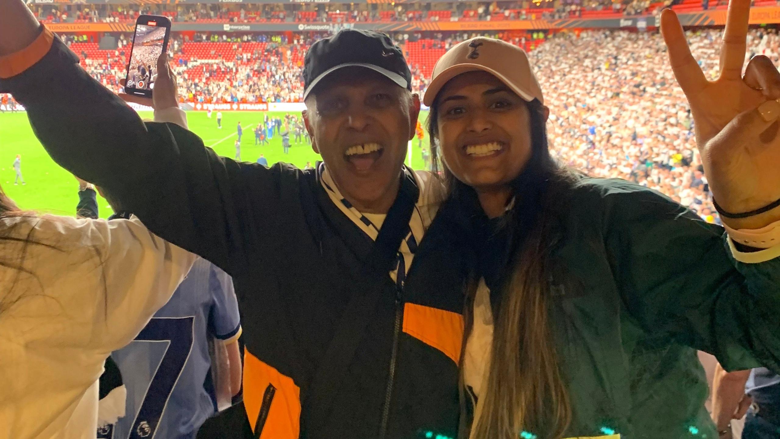 A man and his grown-up daughter celebrate after the Europa League final