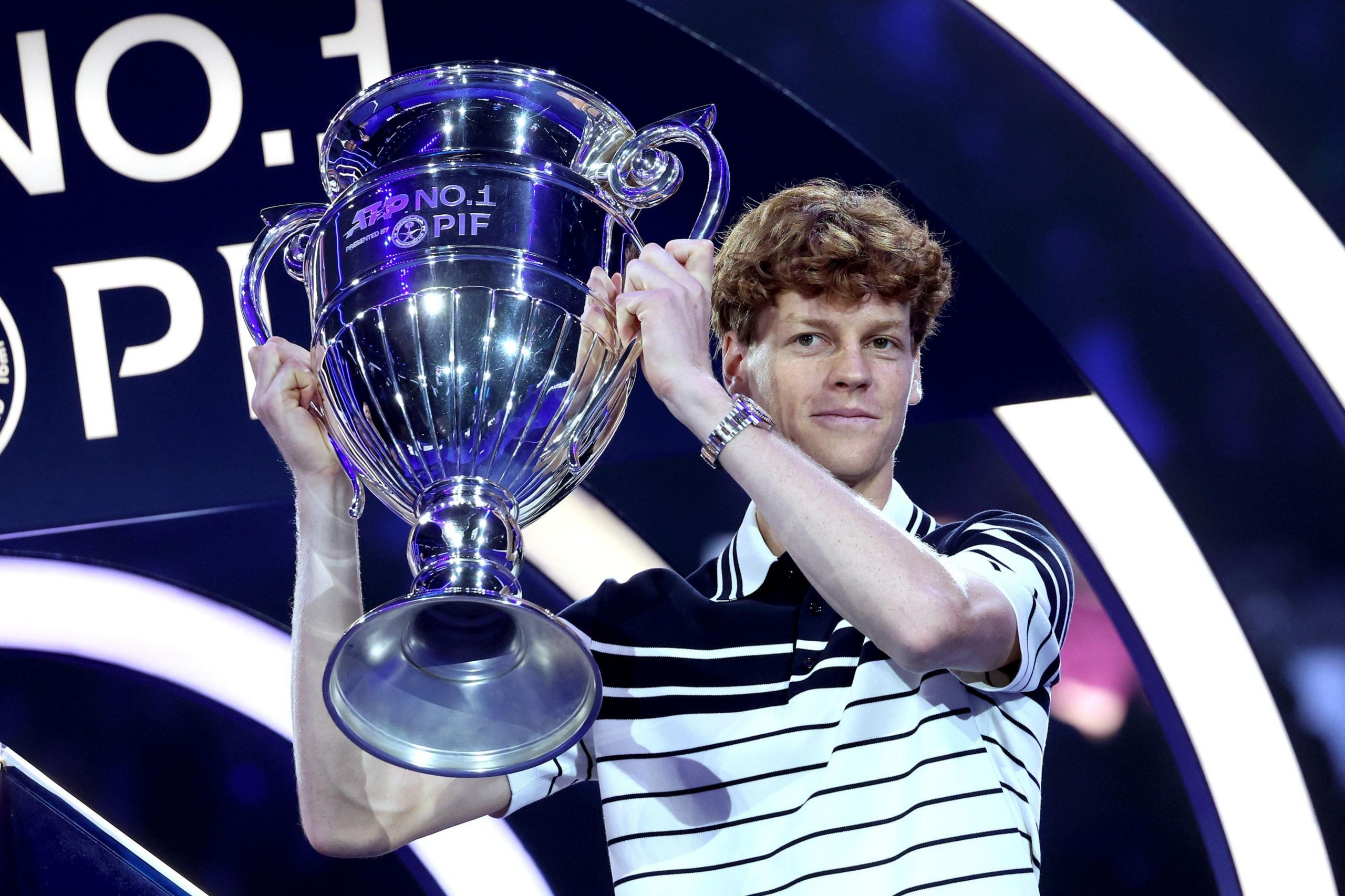 Jannik Sinner lifts the ATP year-end world number one trophy