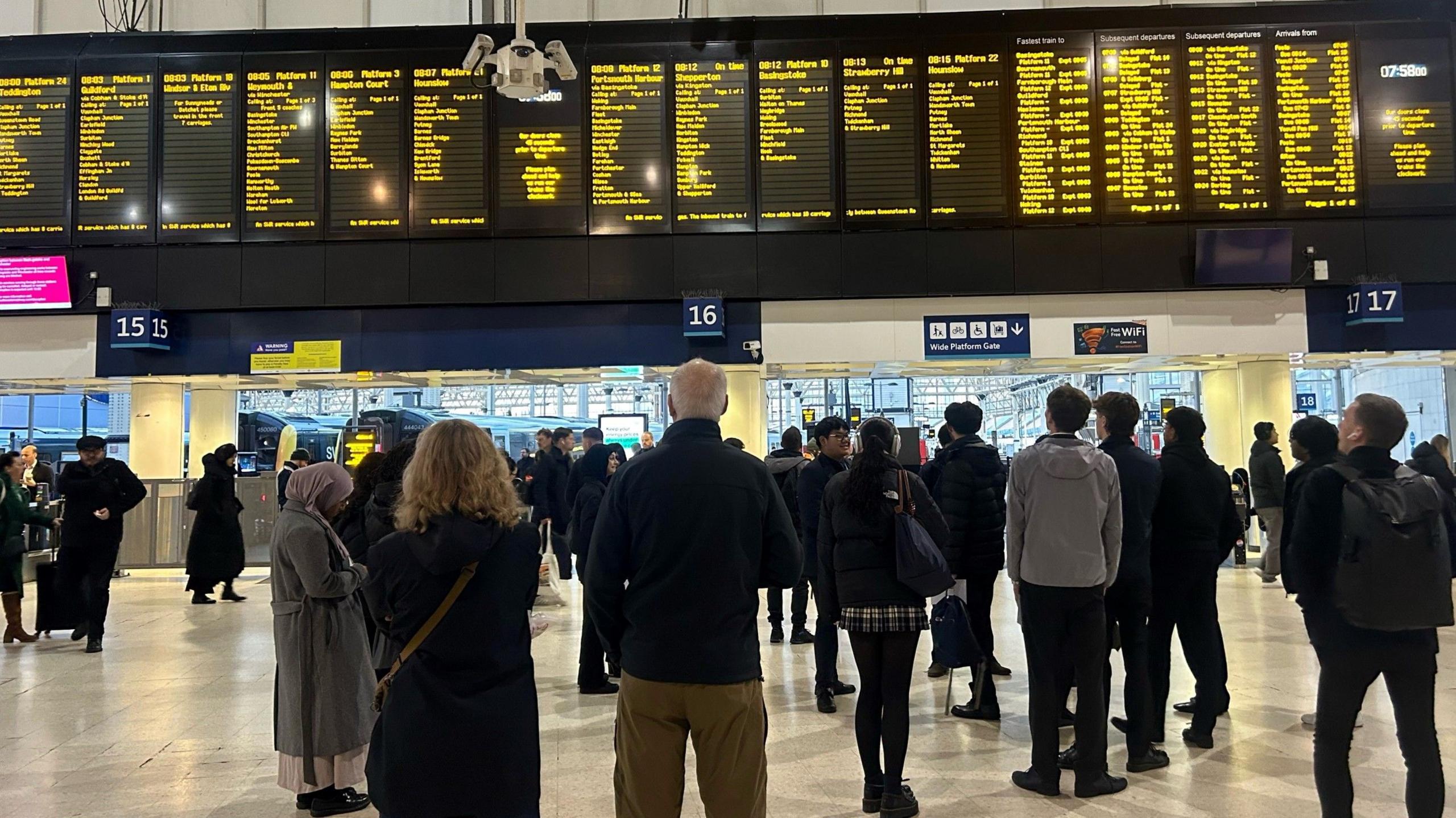 Departure boards showing delays at Waterloo