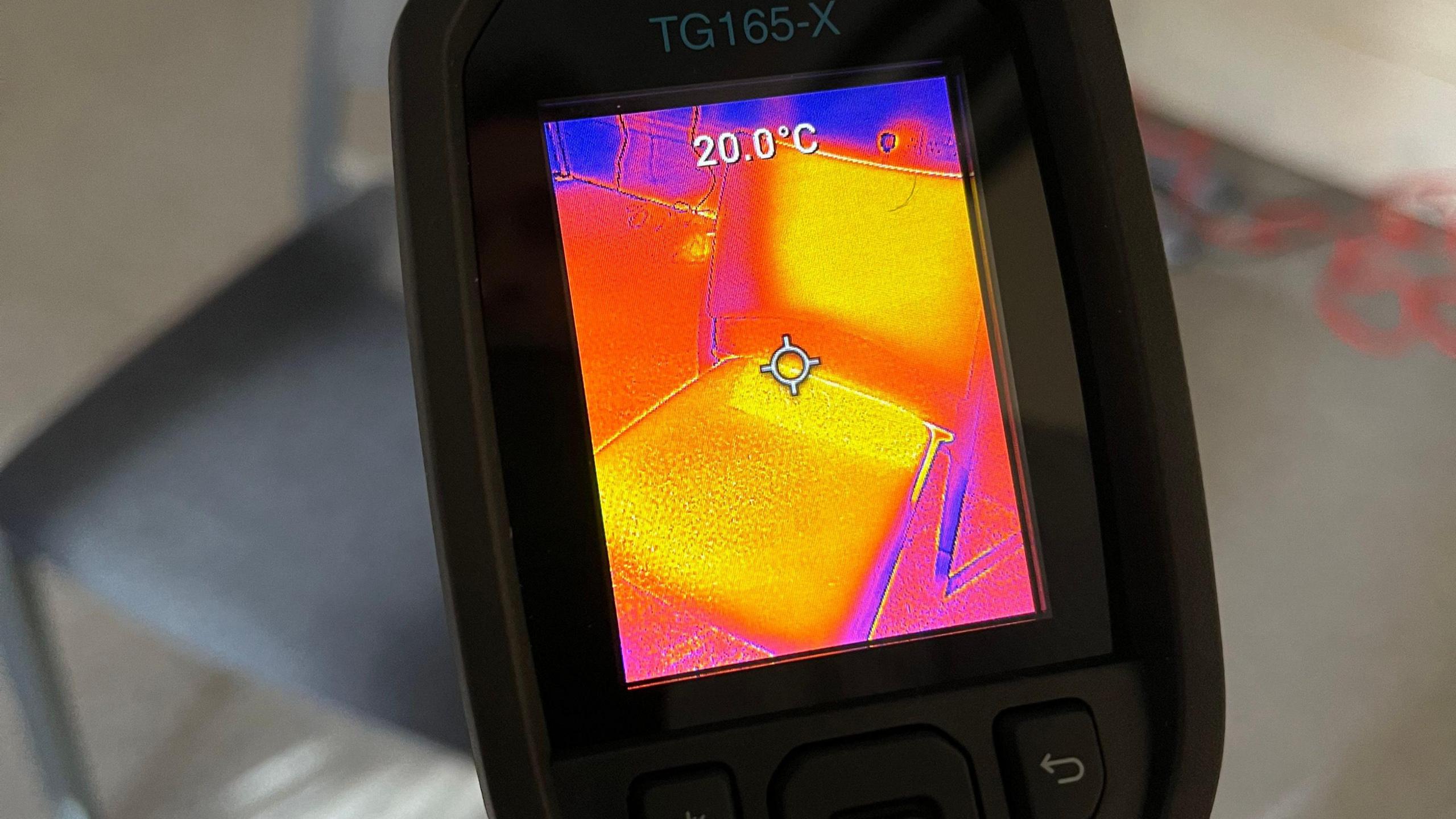 An infrared camera image of a warm chair