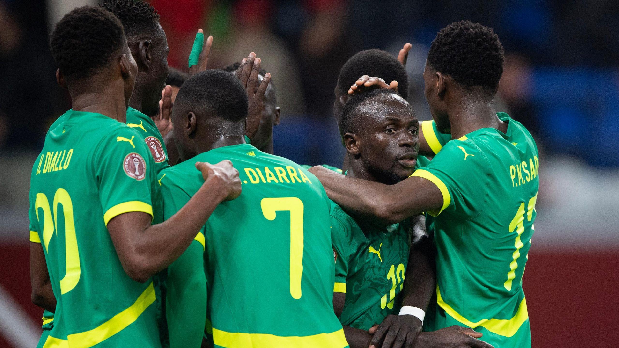 Senegal players celebrate a goal