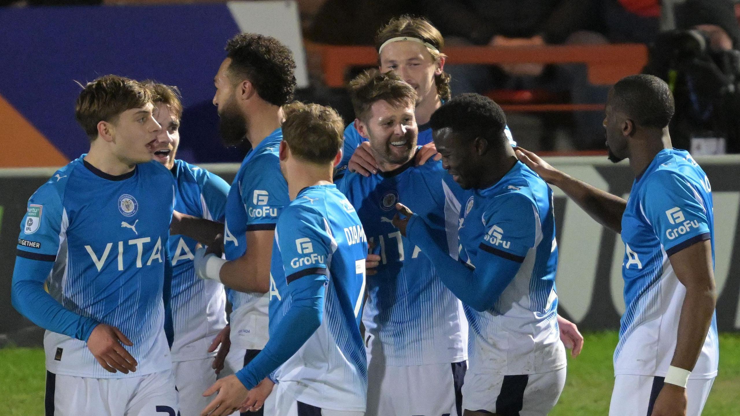 Oliver Norwood celebrates with his team-mates after scoring the winner against Doncaster Rovers 