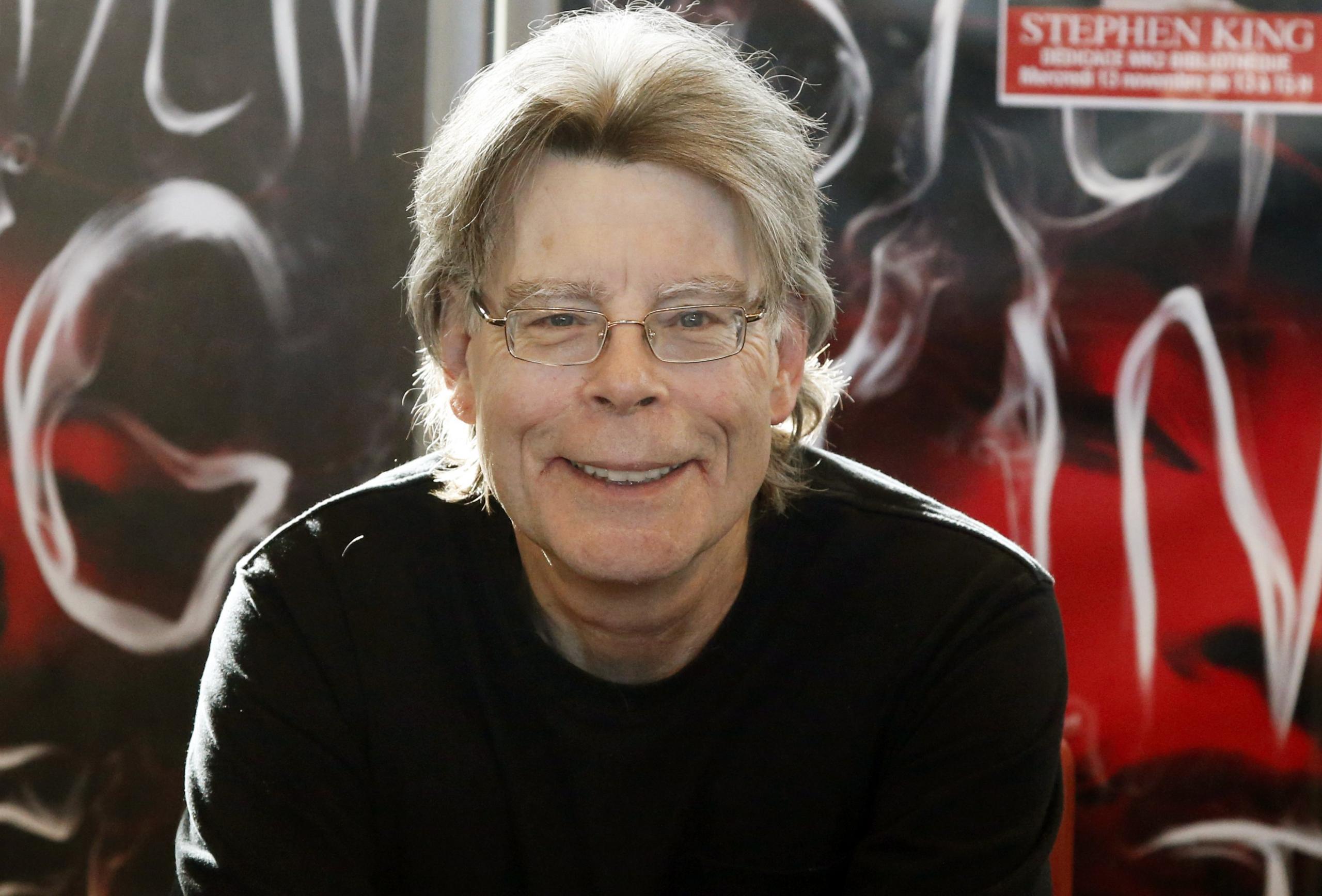 Stephen King posing for cameras during a promotional book tour in Paris on 13 November 2013.