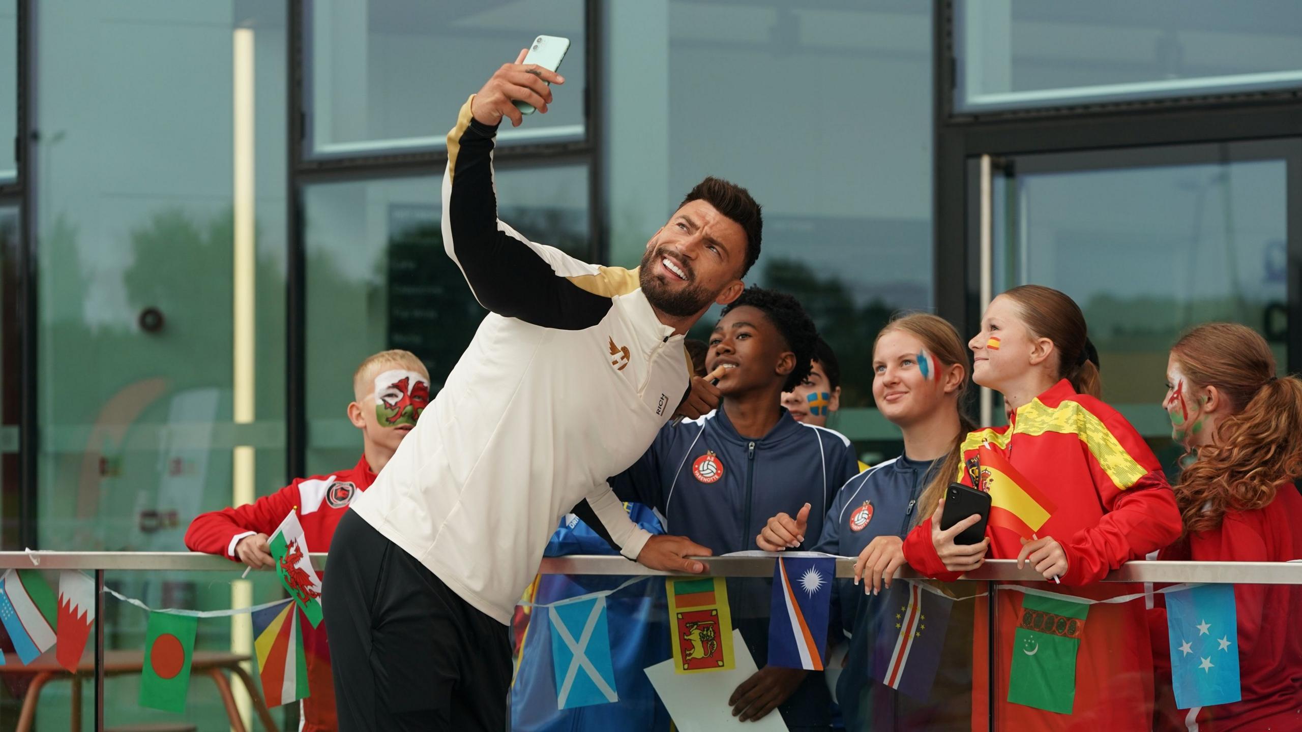 Jake Quickenden taking a selfie with some boys and girls