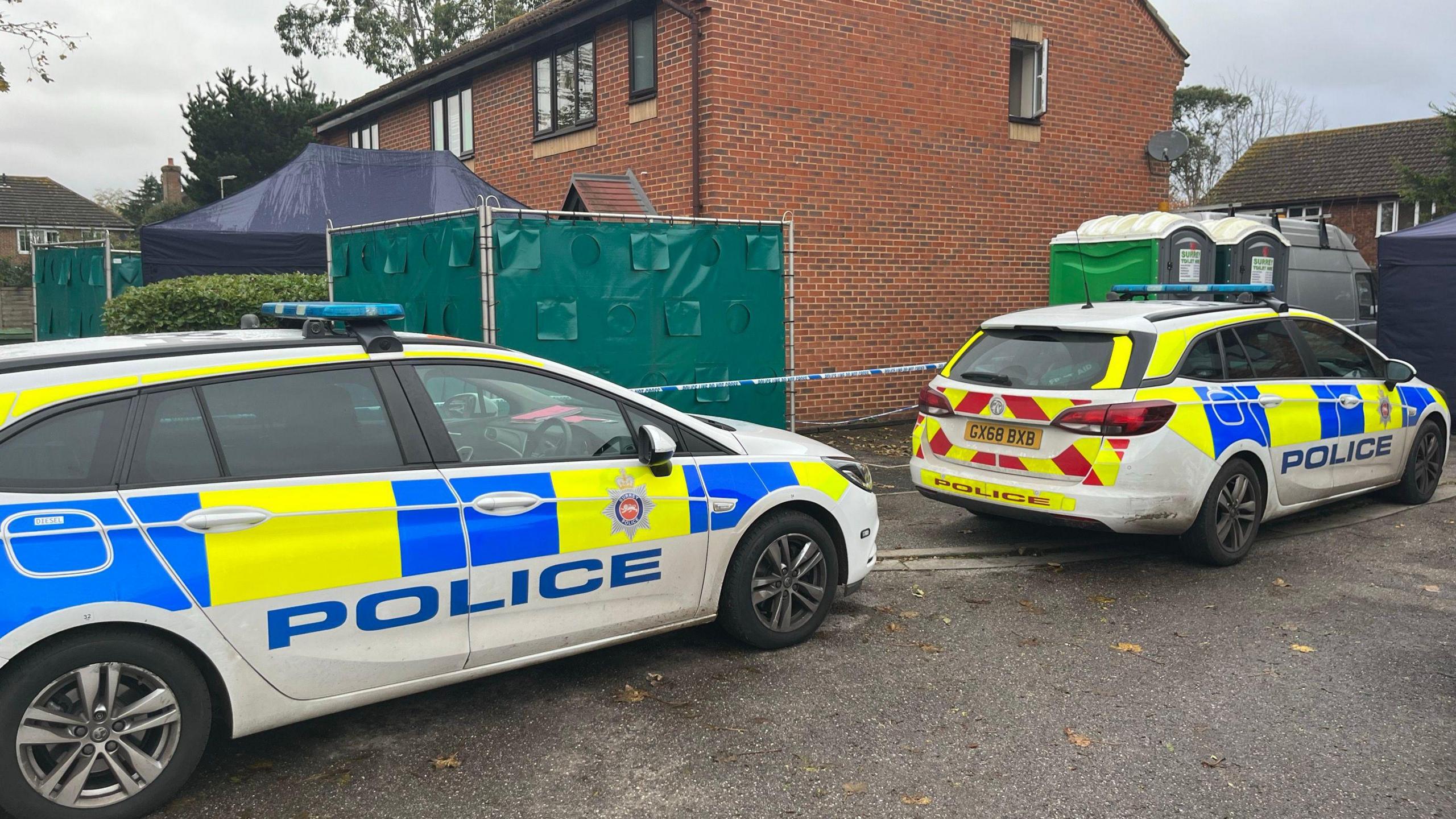 Police cars at scene of murder