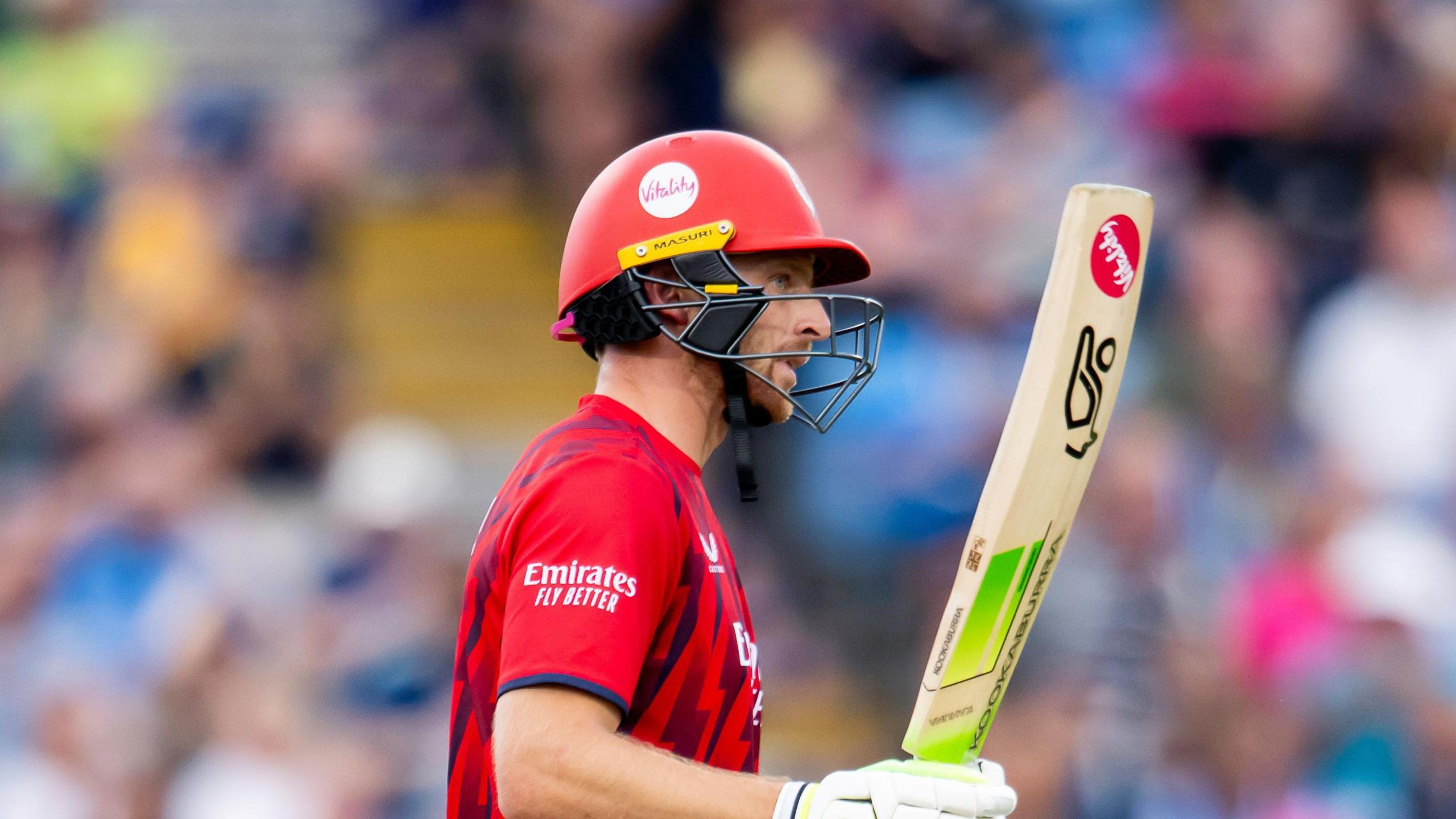 Jos Buttler raises his bat to acknowledge his 50 for Lancashire against Yorkshire at Headingley