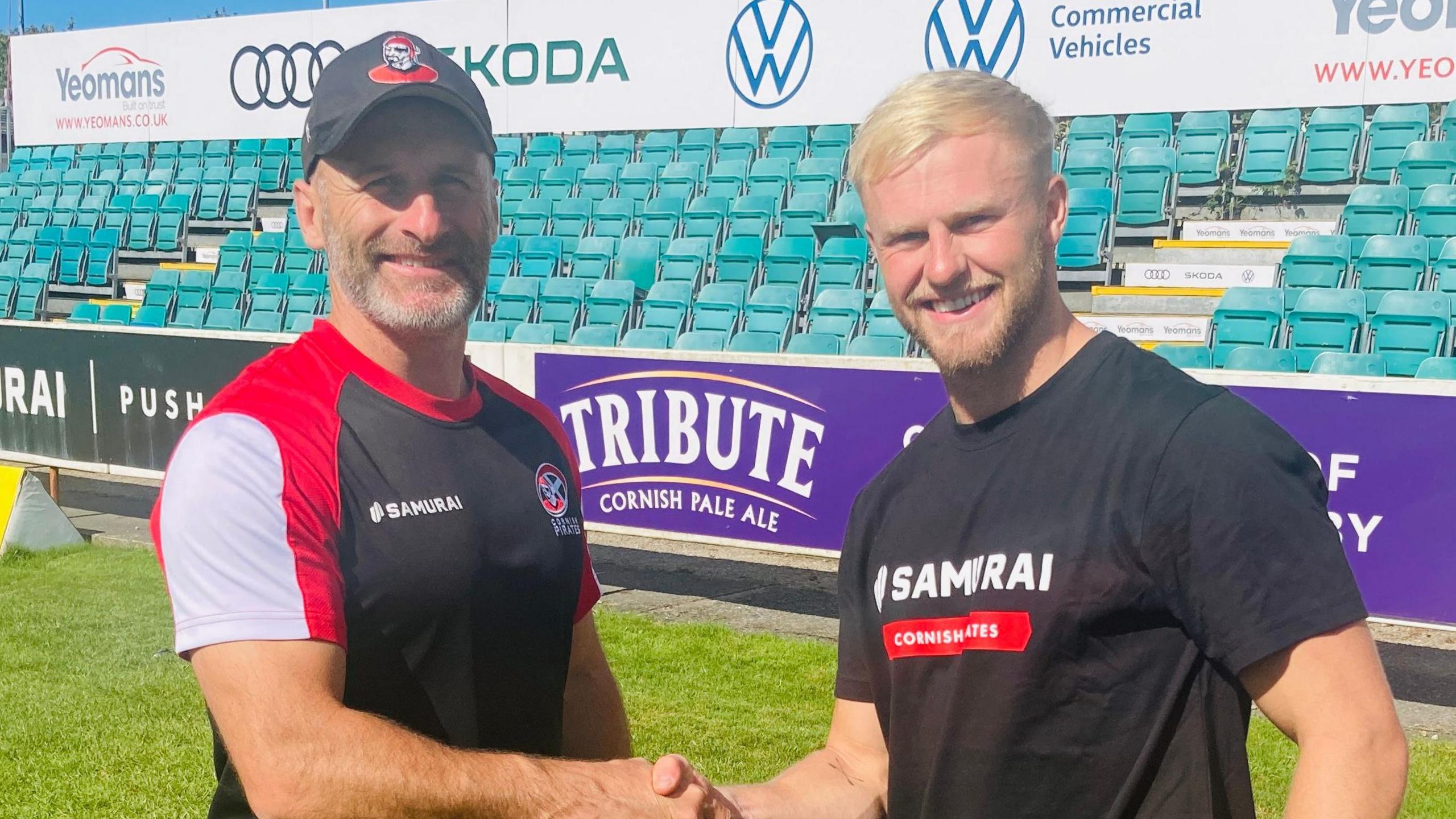 Pirates joint-head coach Gavin Cattle (left) welcomes newest signing Will Rigelsford to the club