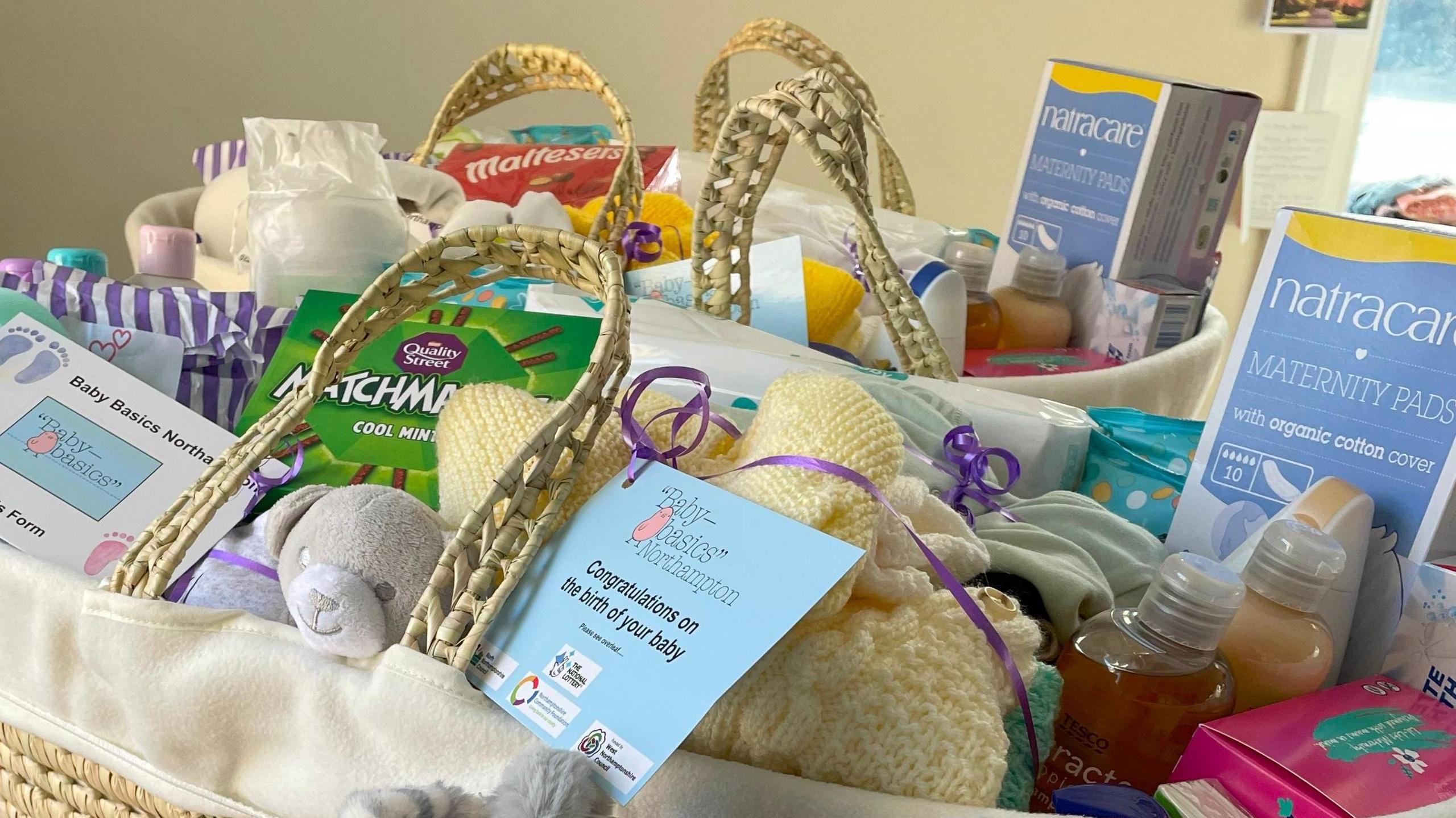 Basket containing toiletries, clothes, treats etc