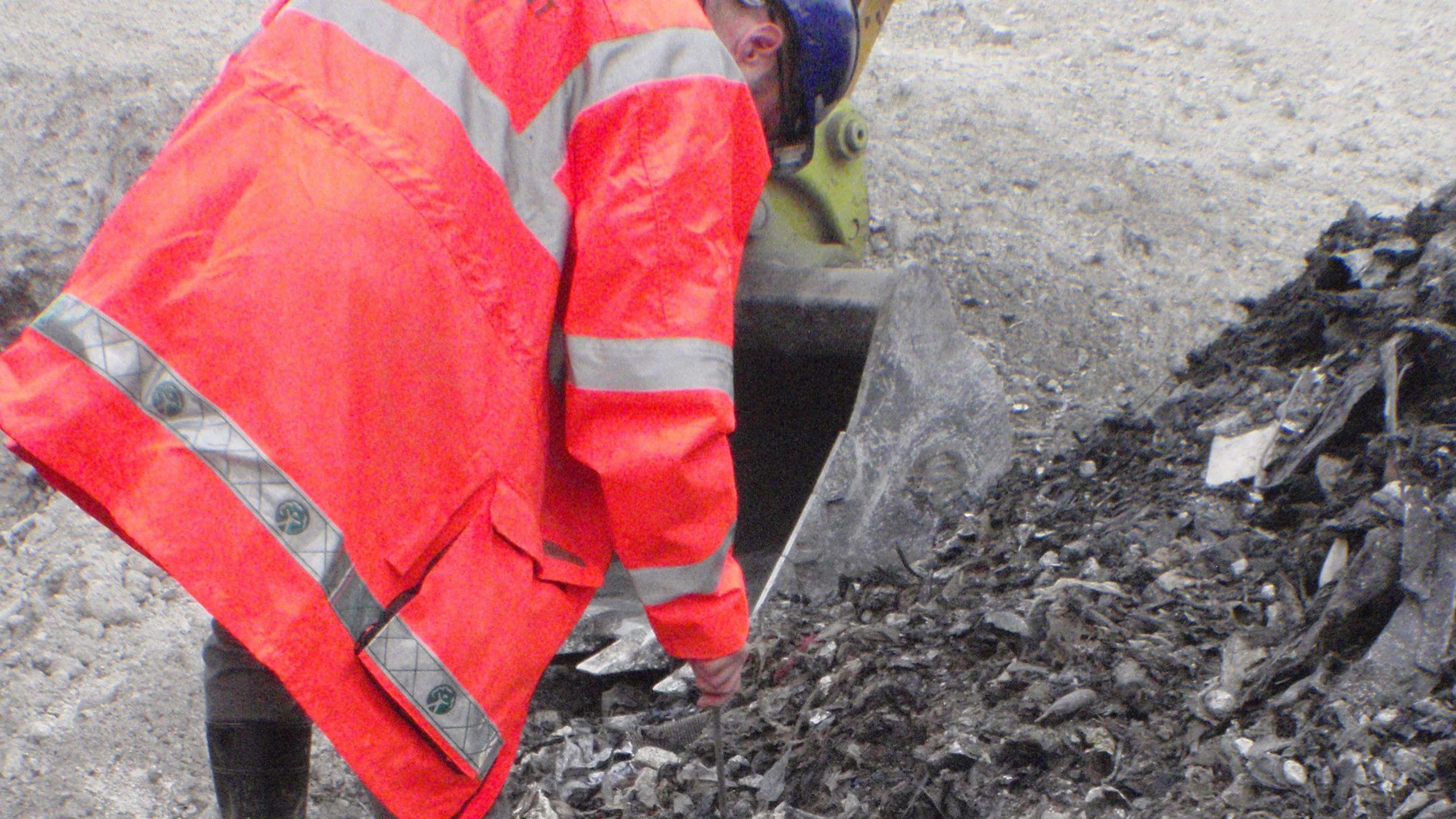 An Environment Agency officer inspecting illegal waste at Codicote Quarry, Hertfordshire