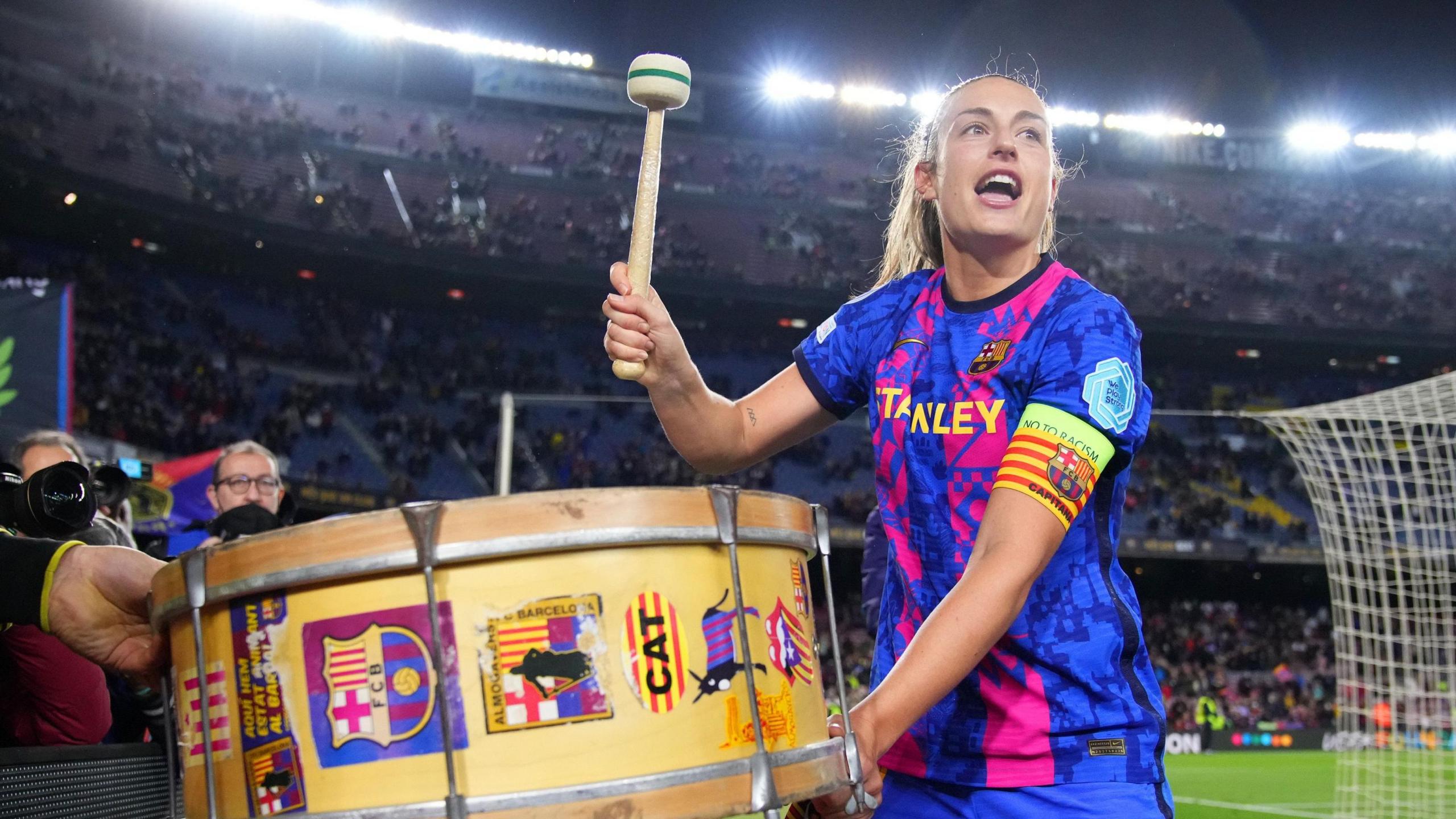 Alexia Putellas plays a drum at the Nou Camp