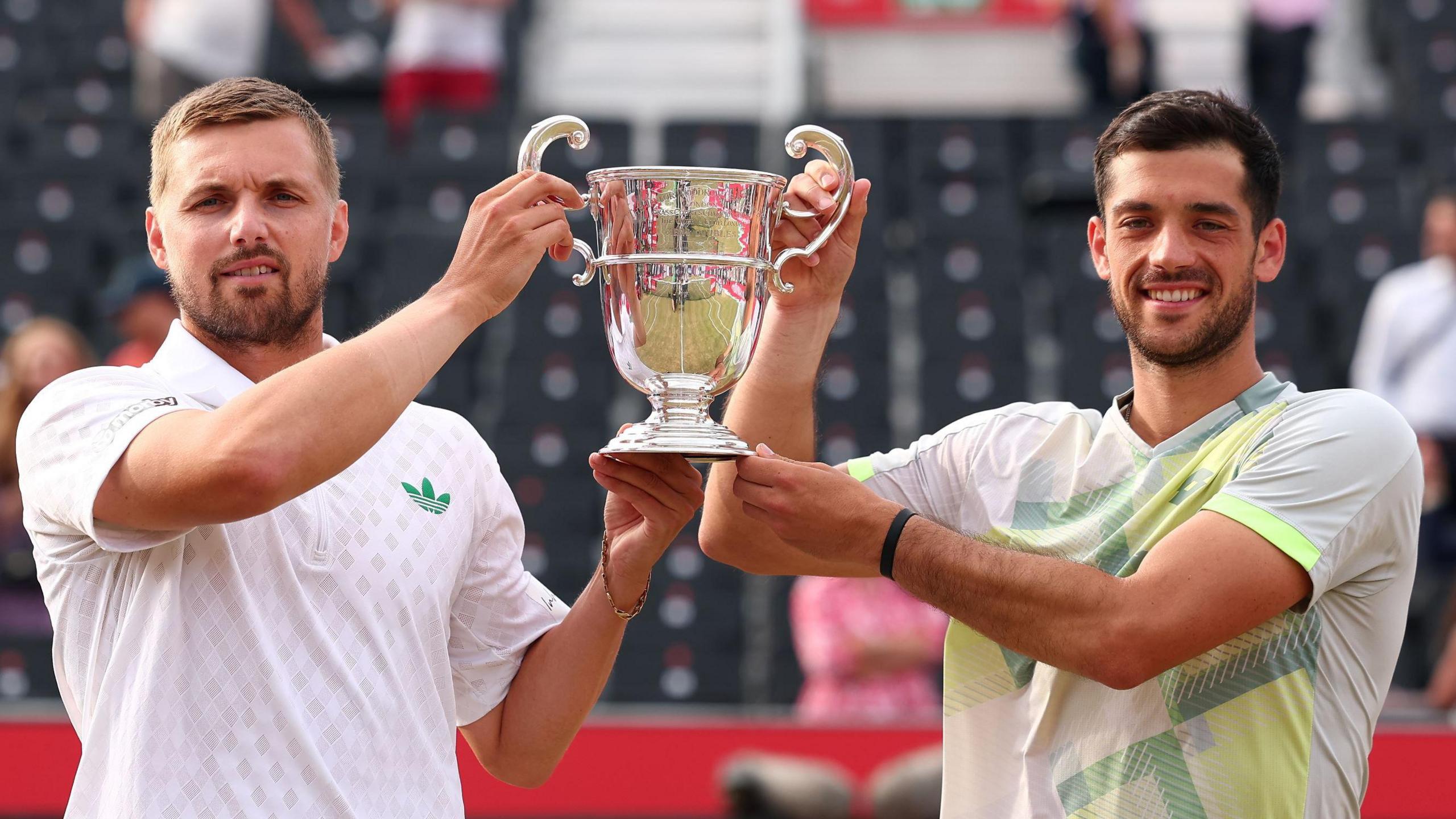 Lloyd Glasspool and Julian Cash lift the Queen's doubles trophy