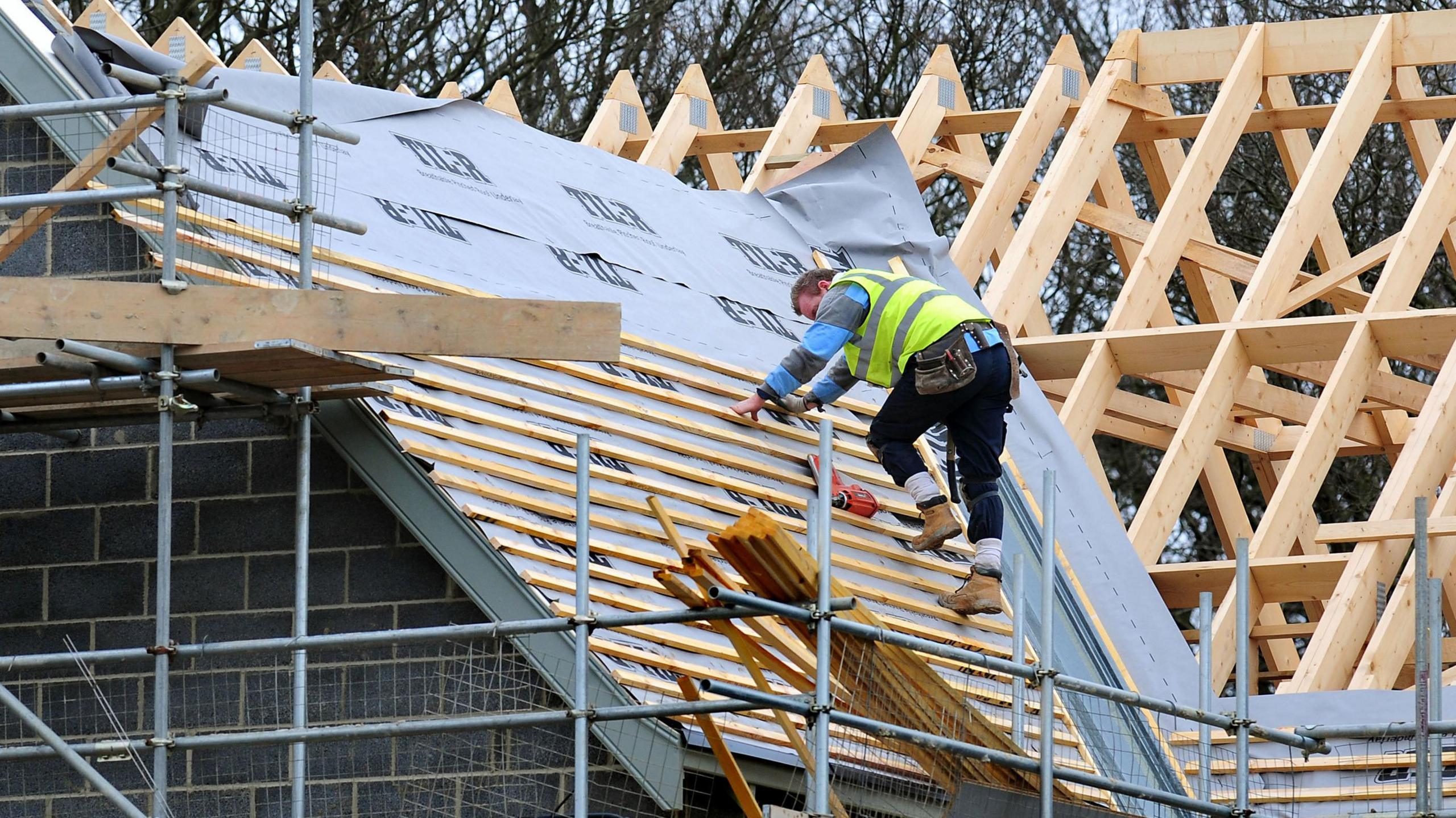 Roofer on new building