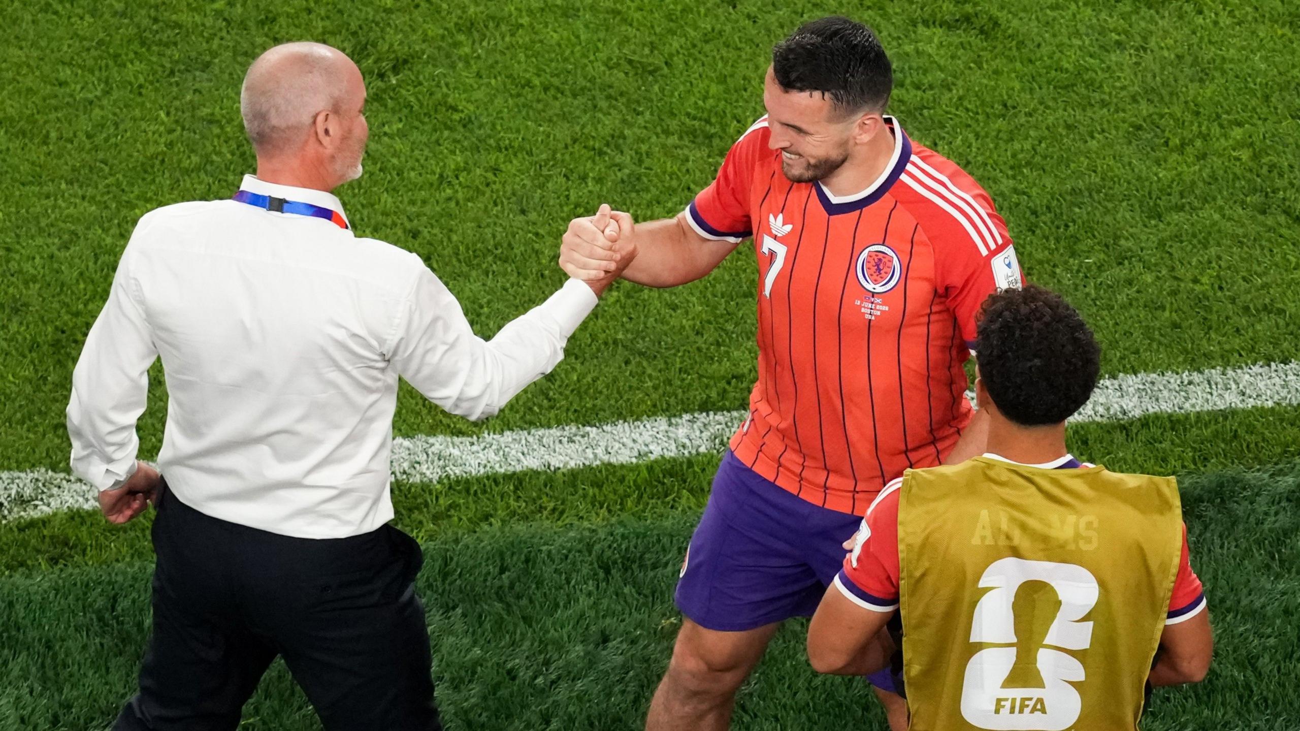Steve Clarke and John McGinn embrace