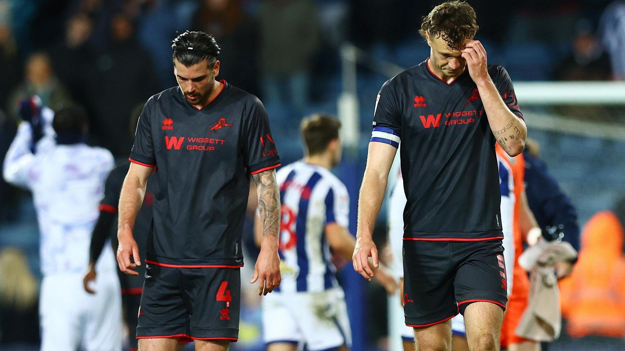 Tristan Crama and Jake Cooper look dejected after drawing against West Bromwich Albion