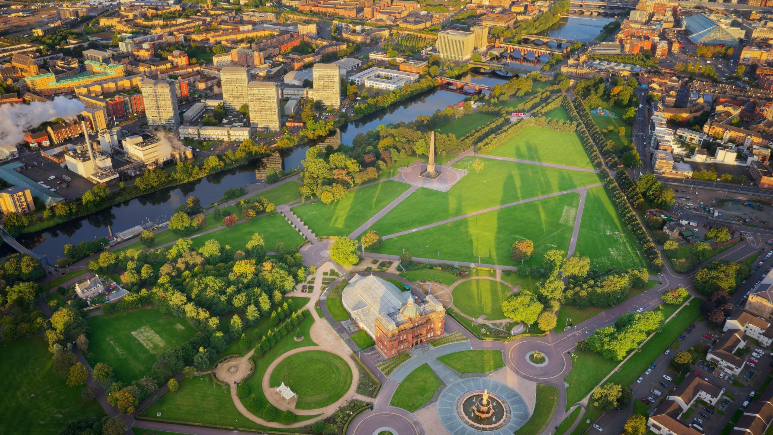 An aerial view of Glasgow and the River Clyde, showing Glasgow Green at sunrise