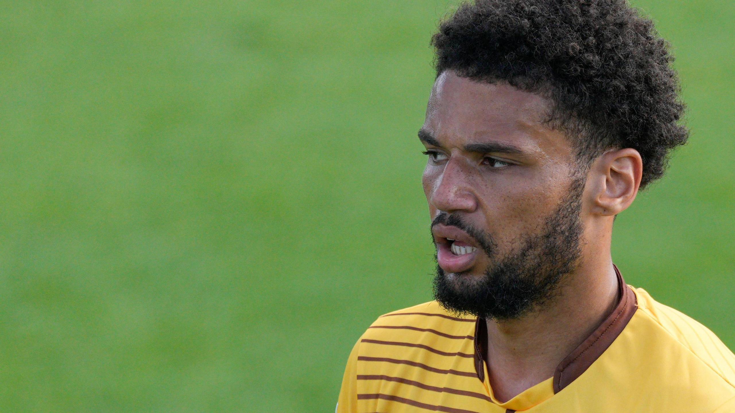 Lee Angol in action for Sutton United