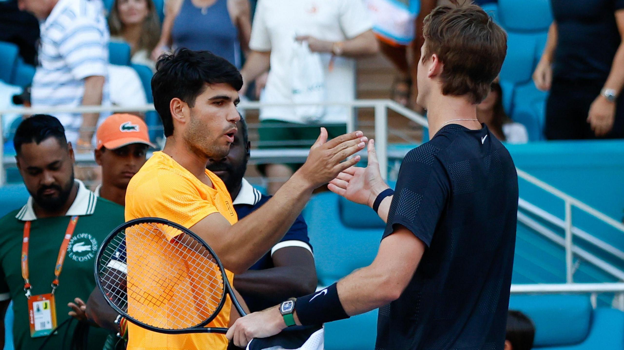 Sebastian Korda and Carlos Alcaraz embrace at the end of their match at the Miami Open