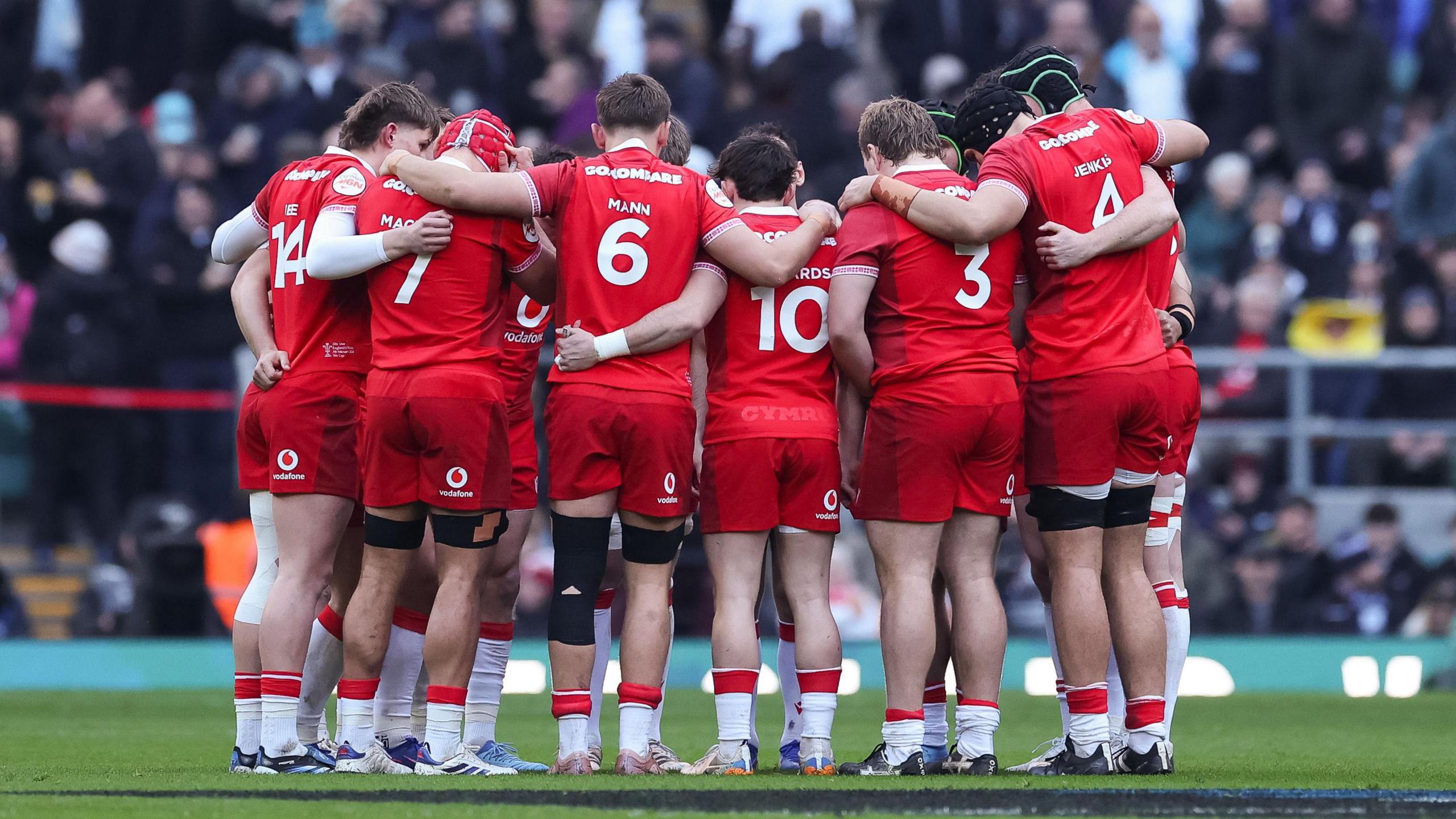 Wales players in a huddle against England