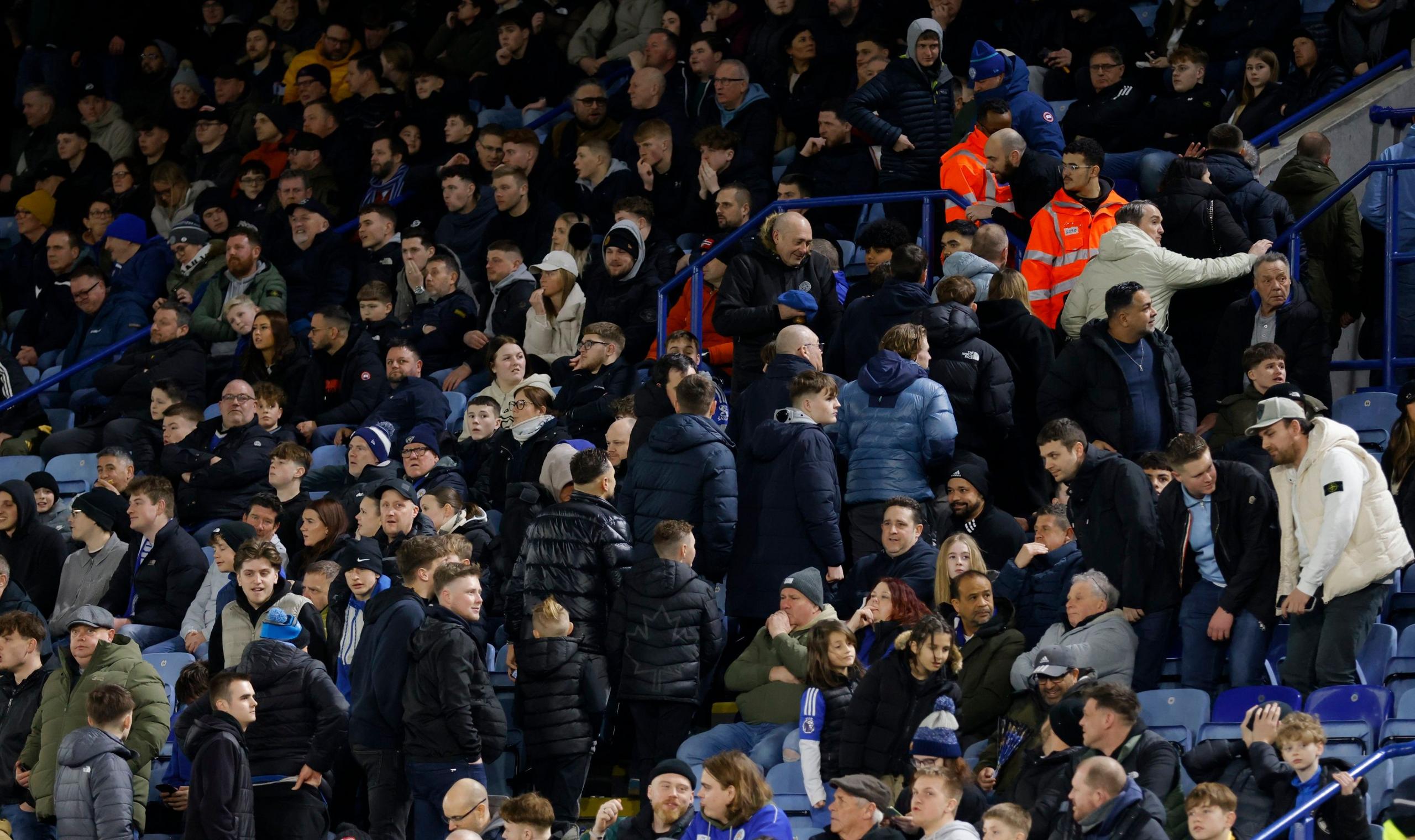 Leicester fans leave the stadium