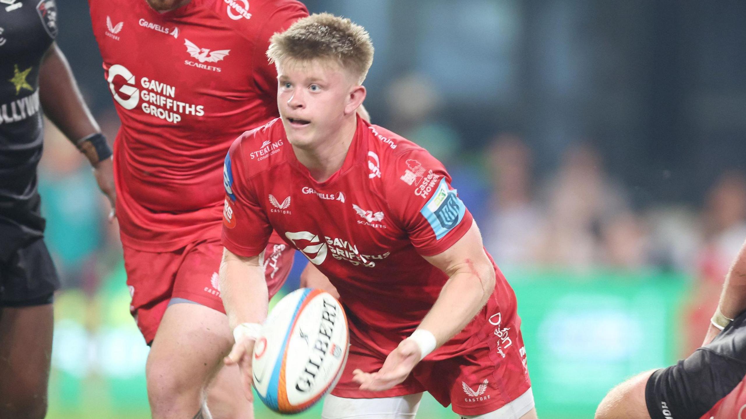 Scarlets scrum-half Archie Hughes in action