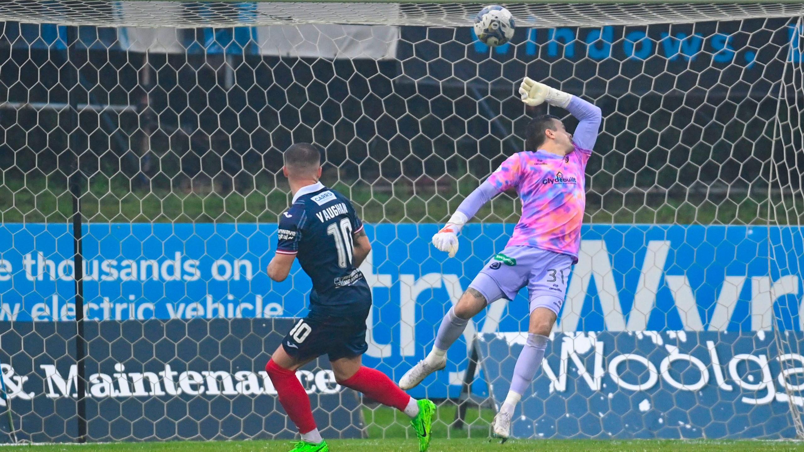 Lewis Vaughan scores against Partick Thistle goalkeeper David Mitchell at Firhill